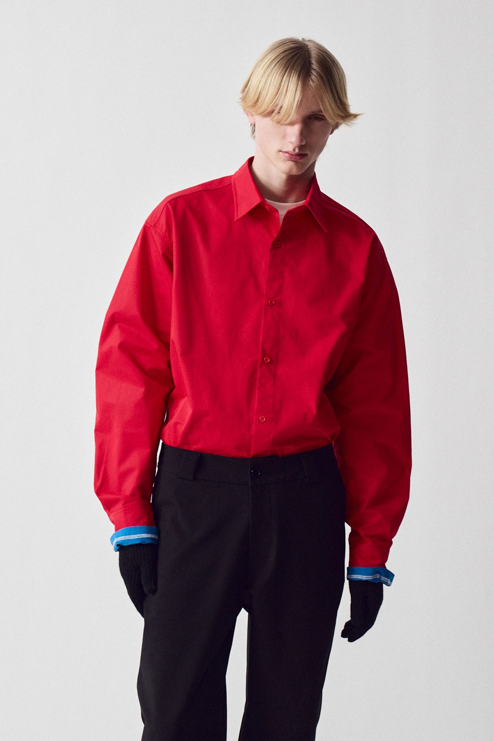 red relaxed shirt with black pants
