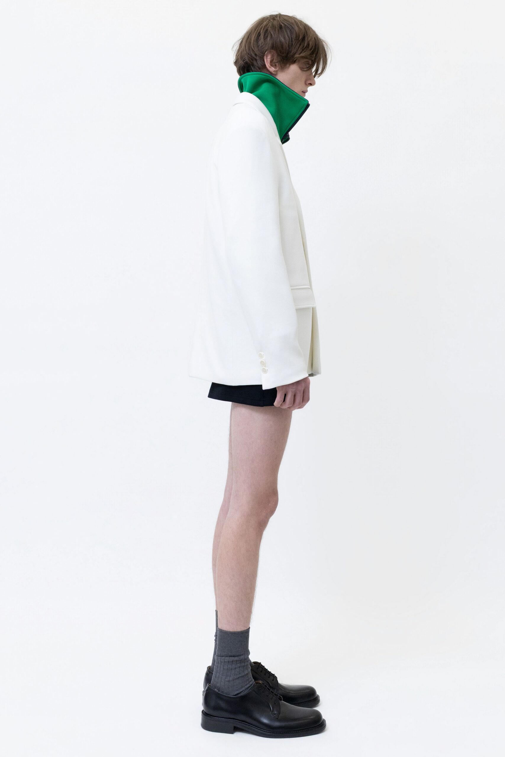 white structured jacket with black shorts
