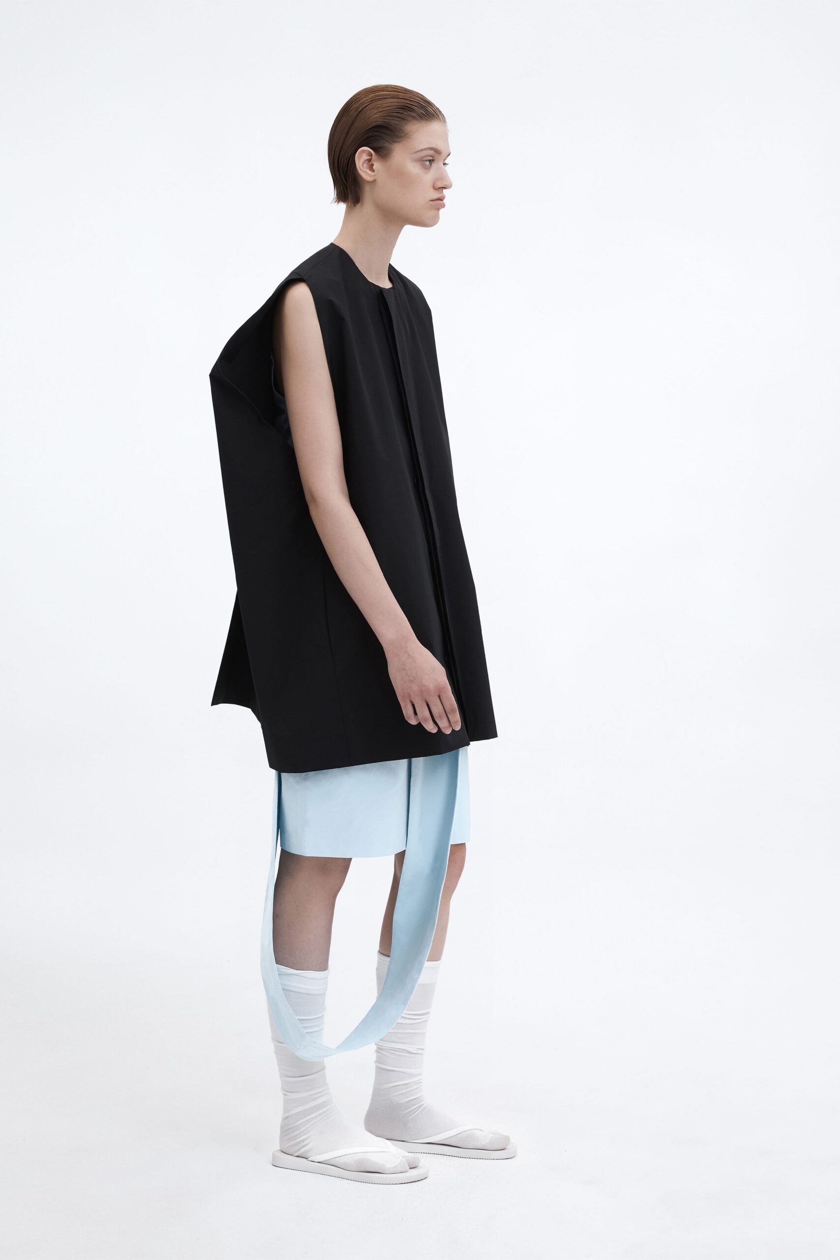 black oversized top with blue skirt