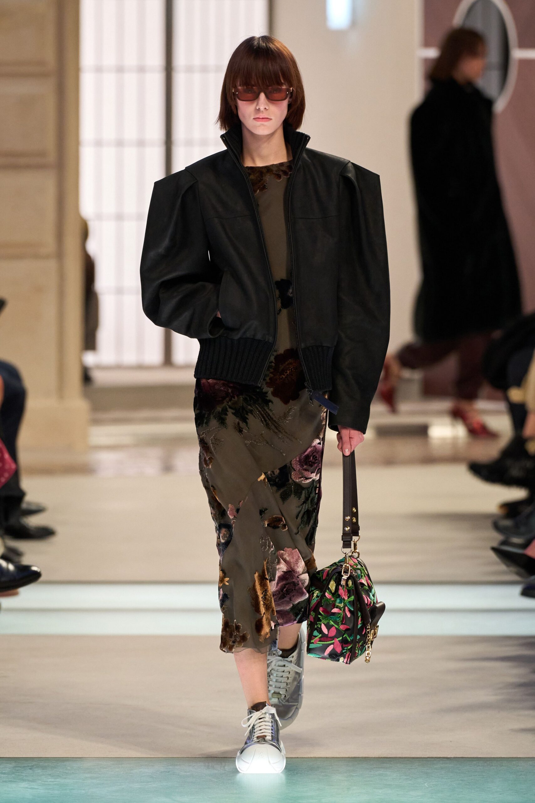 black leather jacket with floral dress