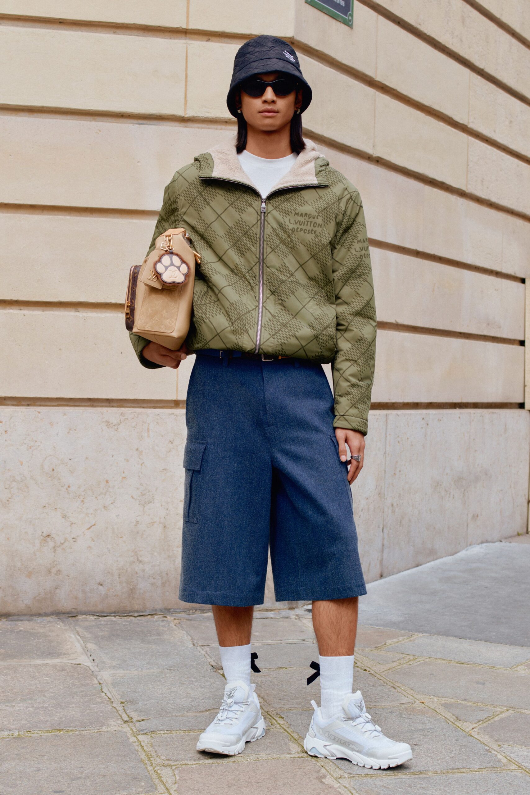 green quilted jacket with denim shorts