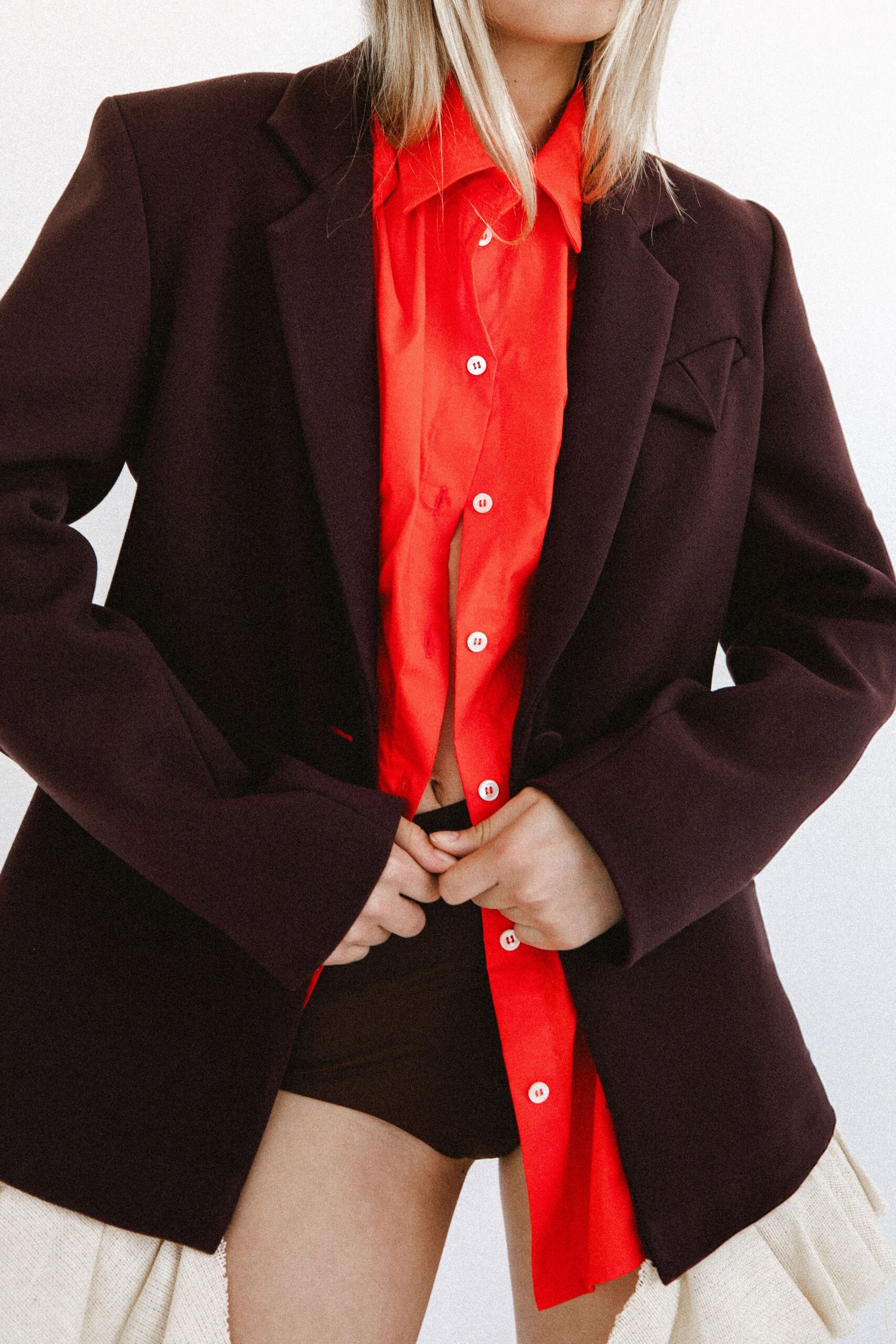 black blazer red shirt black shorts