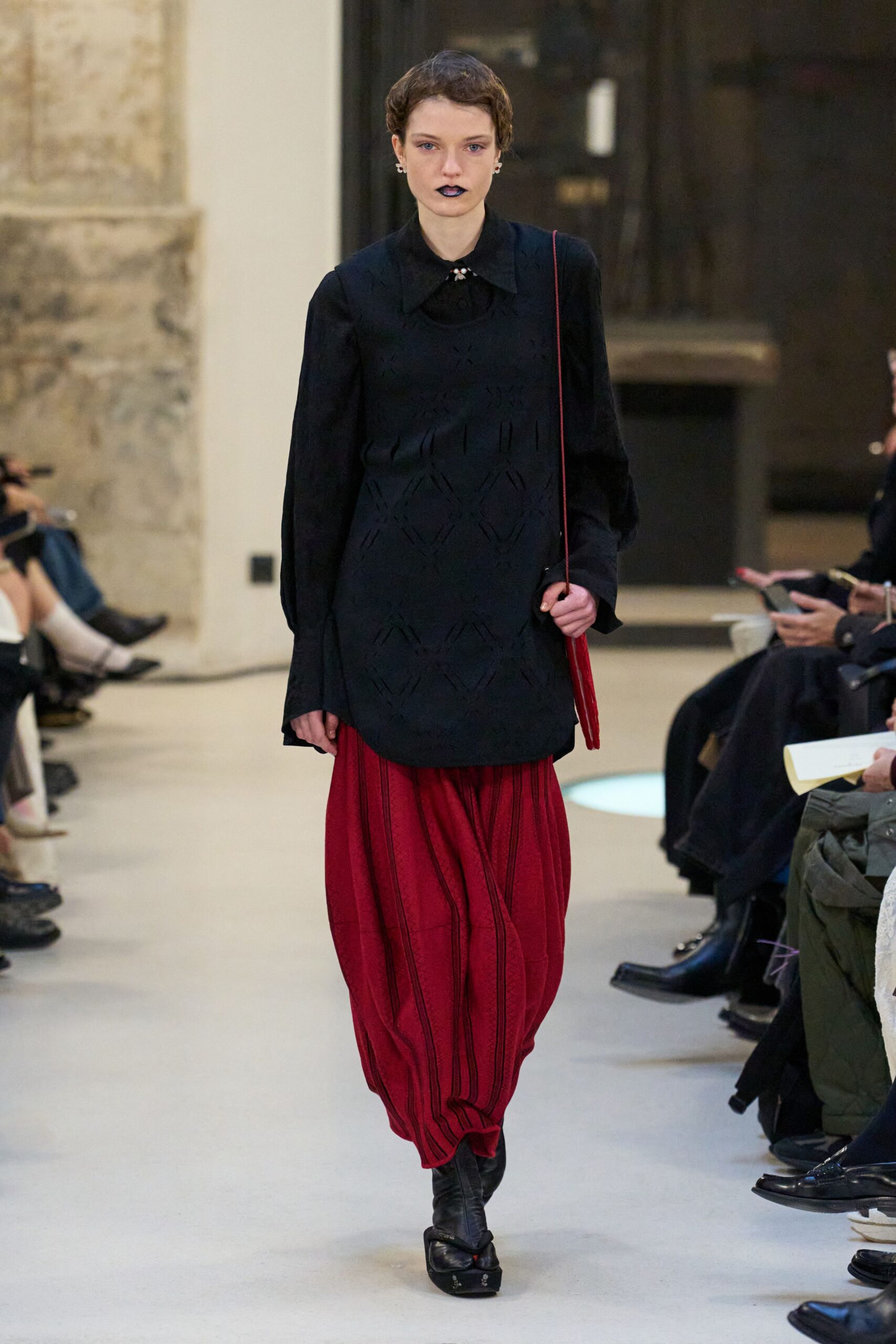 black top red pants outfit