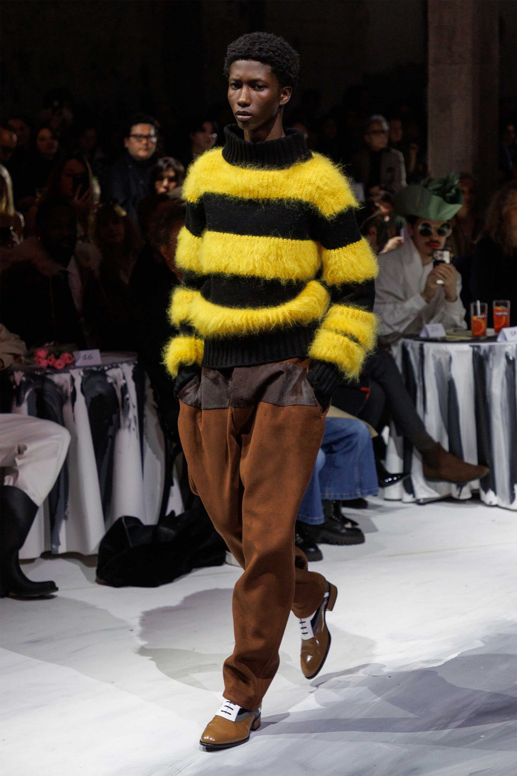 yellow black striped sweater with brown pants