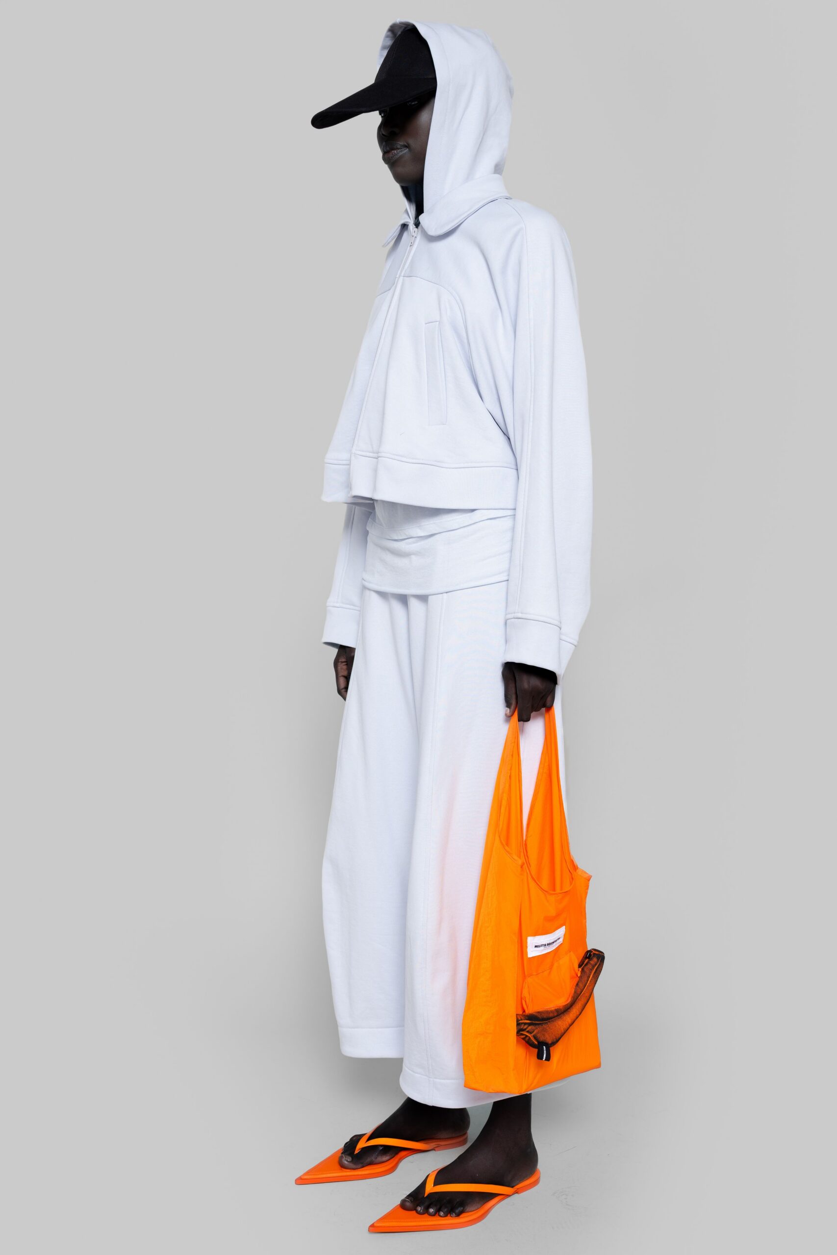white cropped hoodie with orange bag