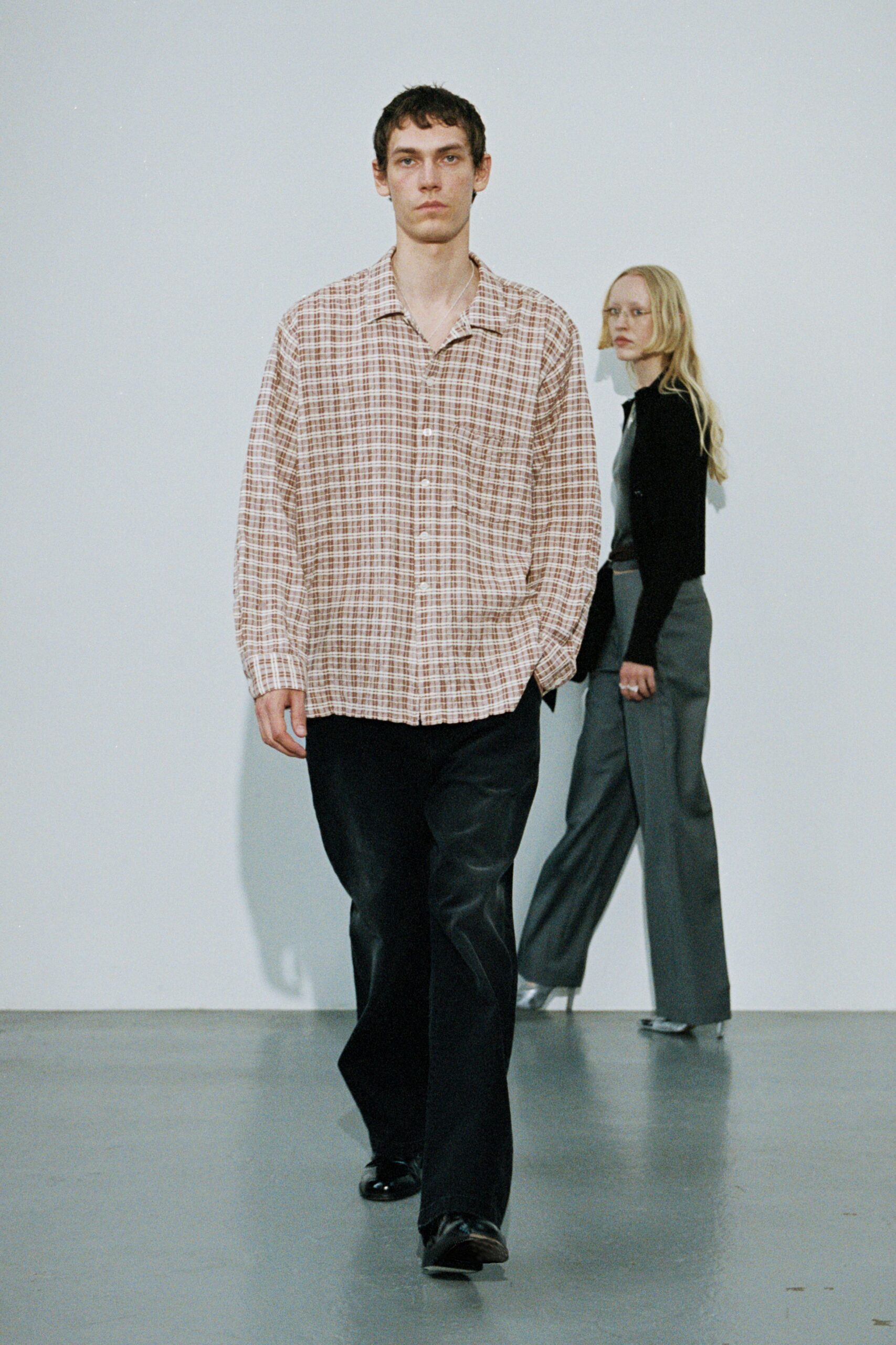beige checked shirt with black pants
