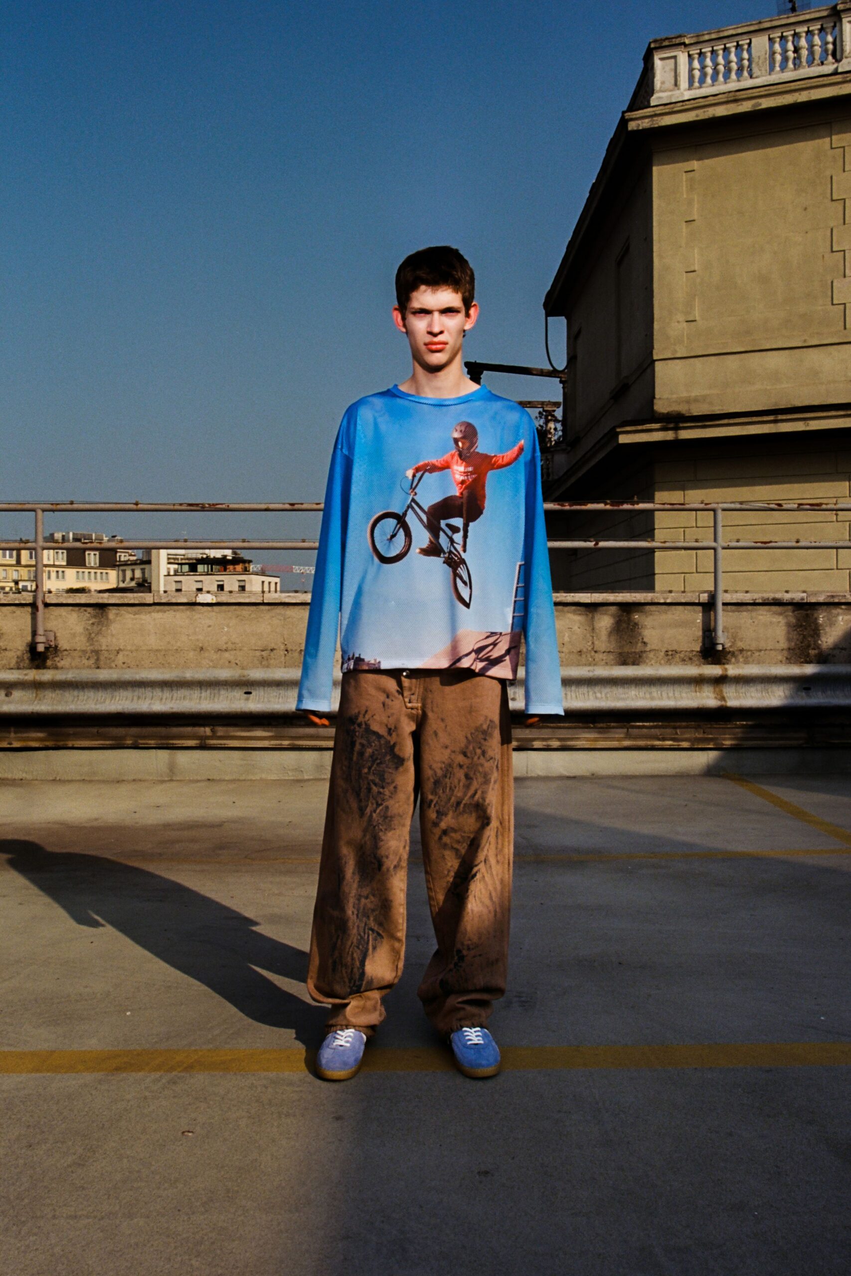 blue printed long-sleeve top with brown pants
