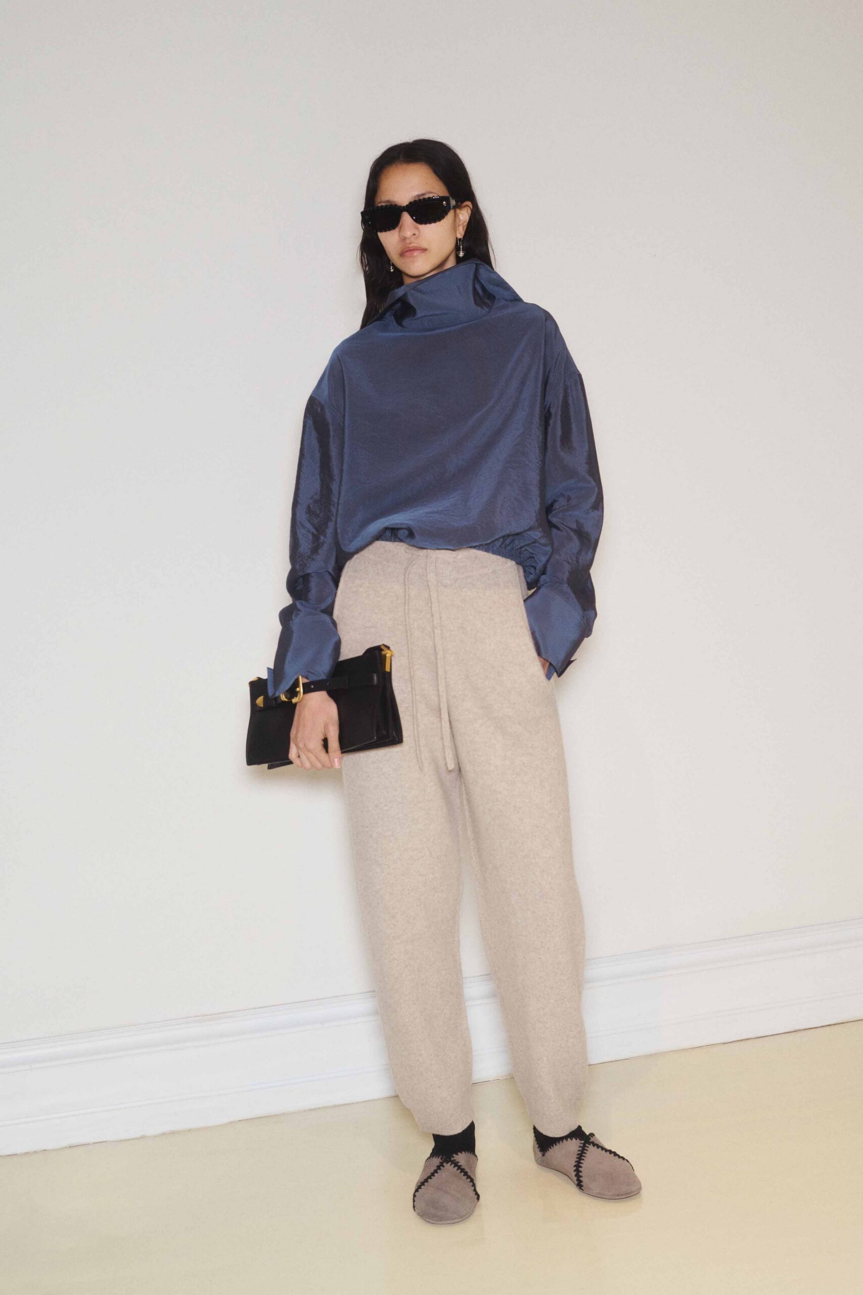 blue silk relaxed top with beige pants