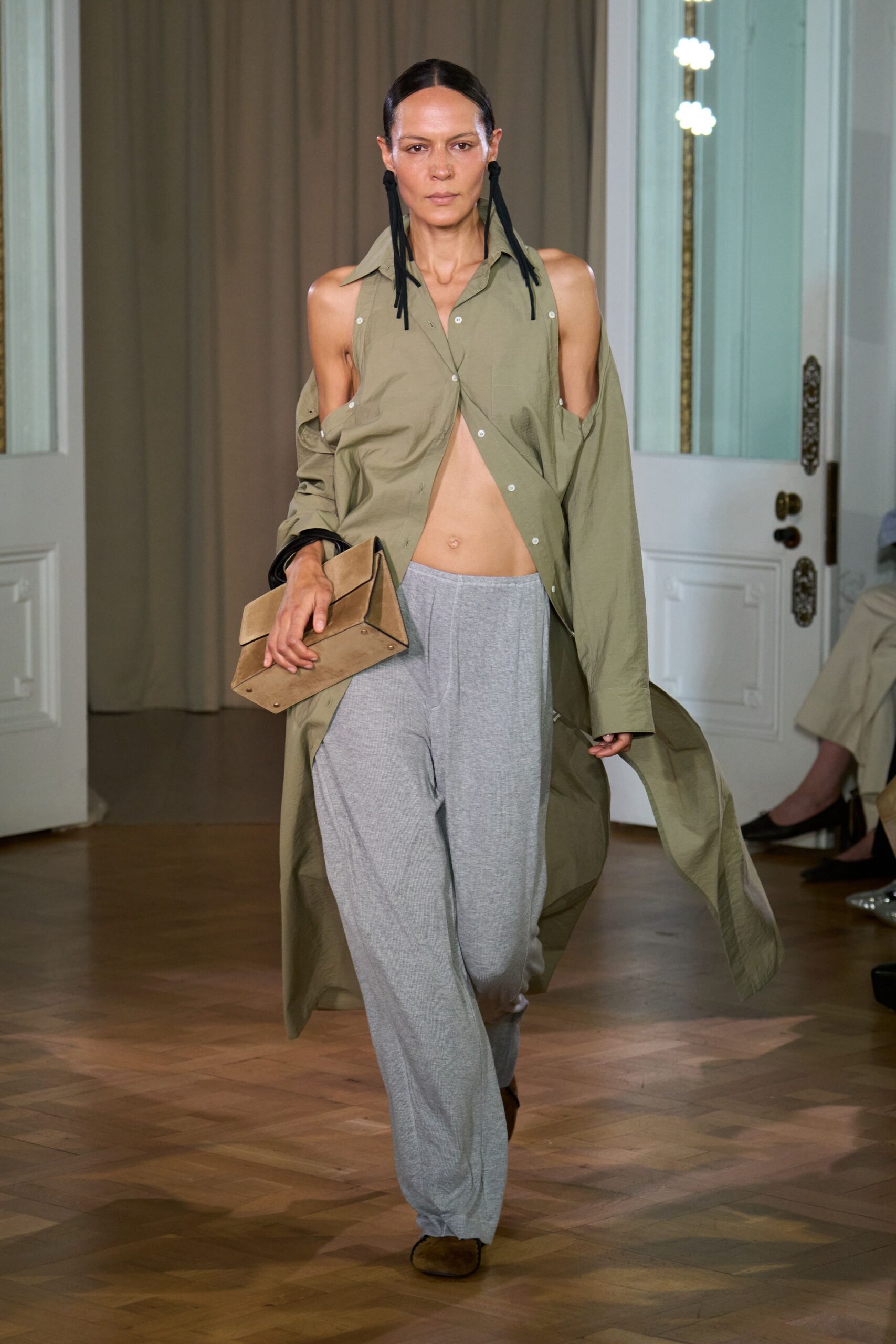 green shirt gray pants bag