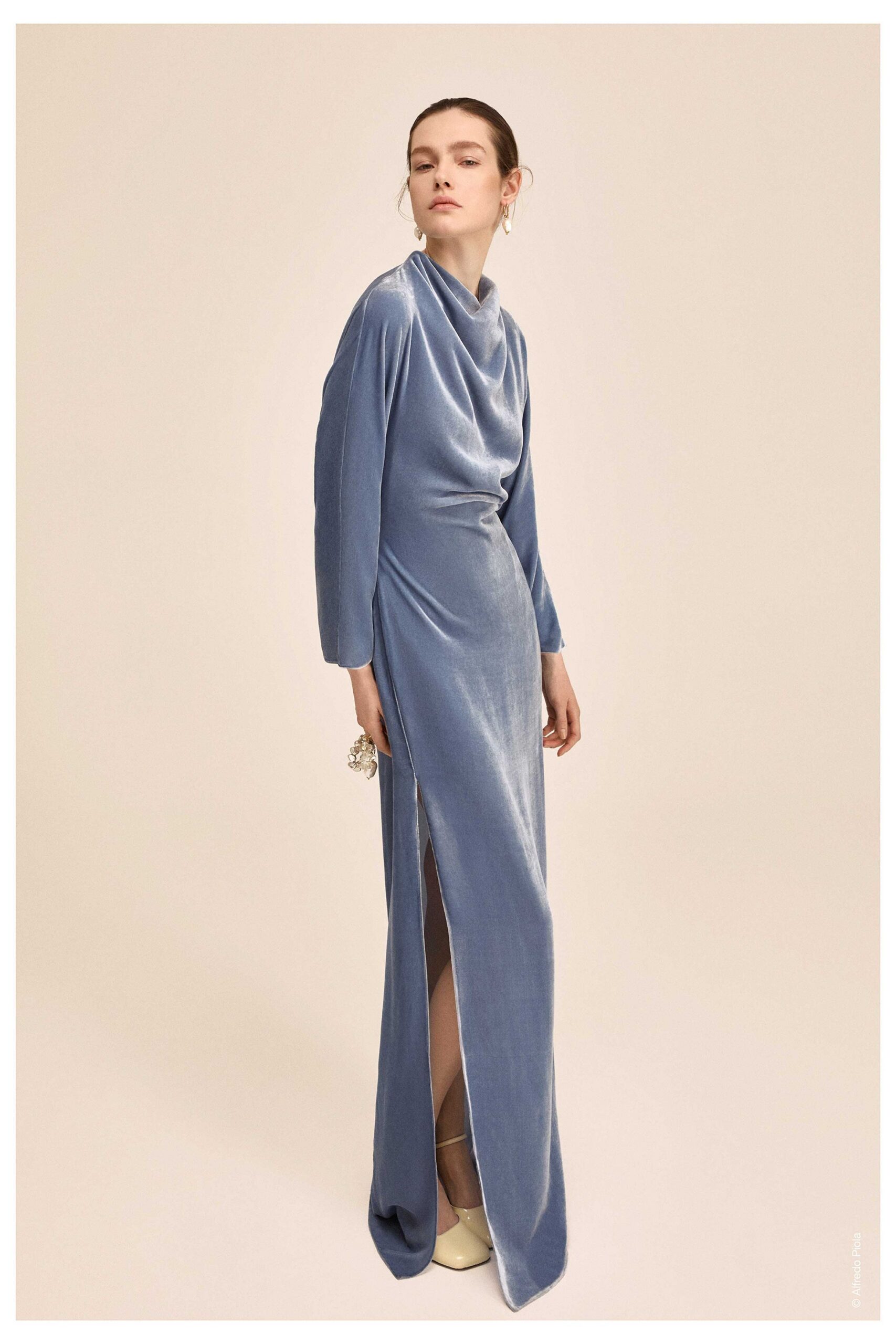 blue velvet long-sleeve high-neck fitted draped flowing gown