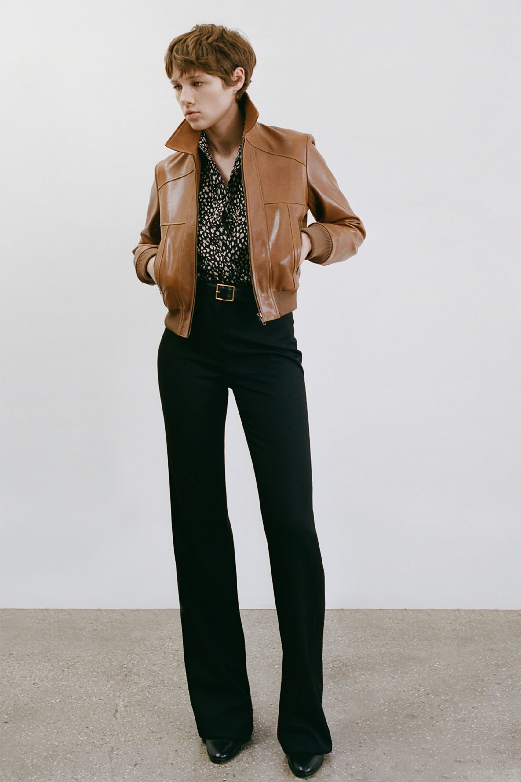 brown leather jacket with printed shirt