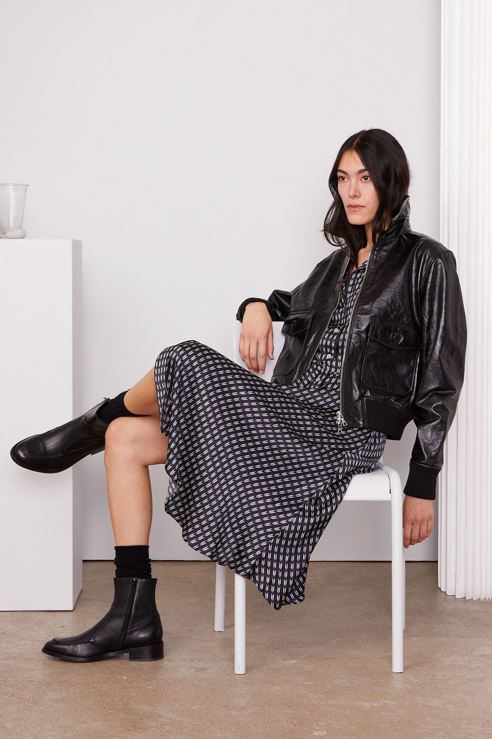 black leather jacket with printed dress