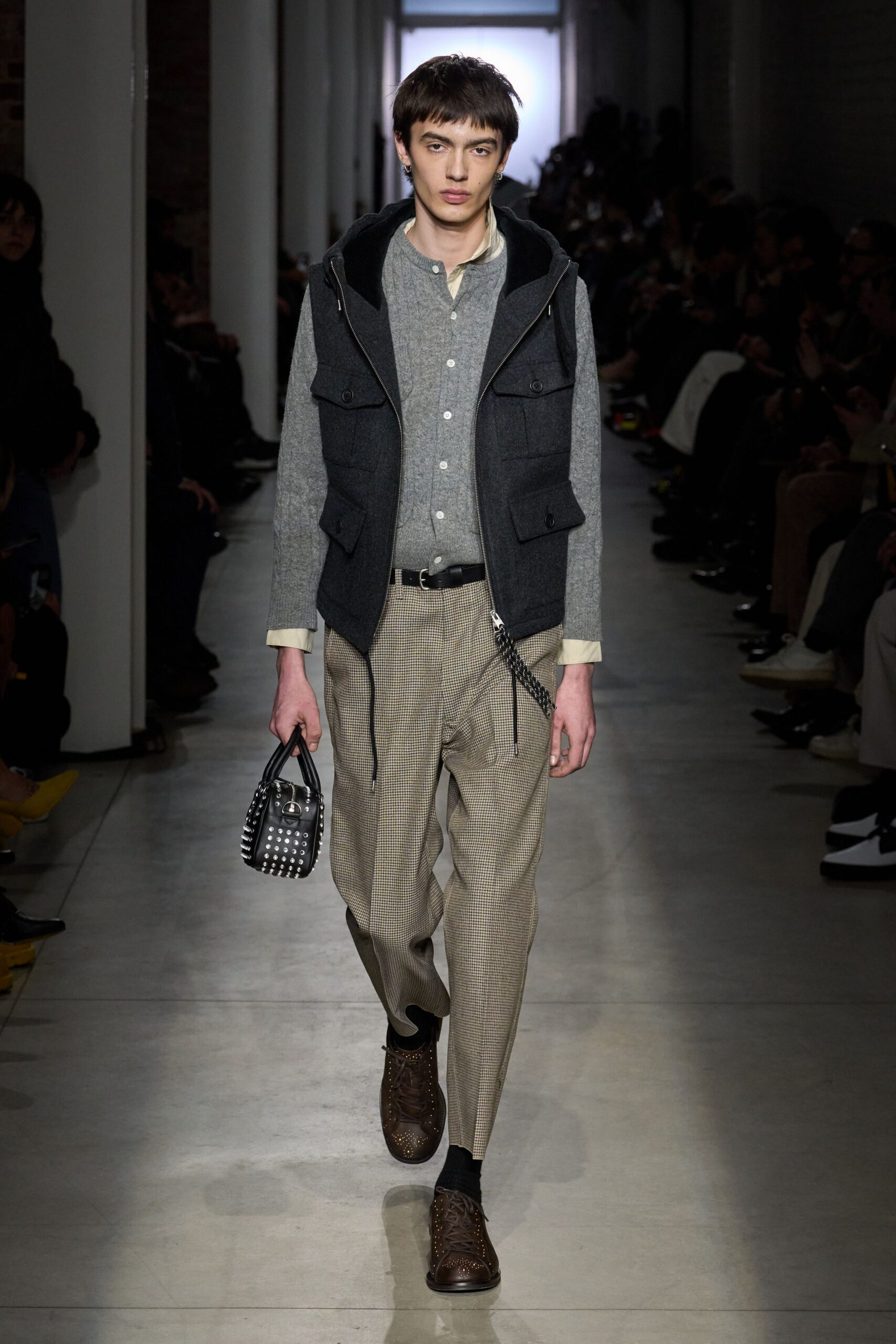 black wool vest gray shirt beige pants