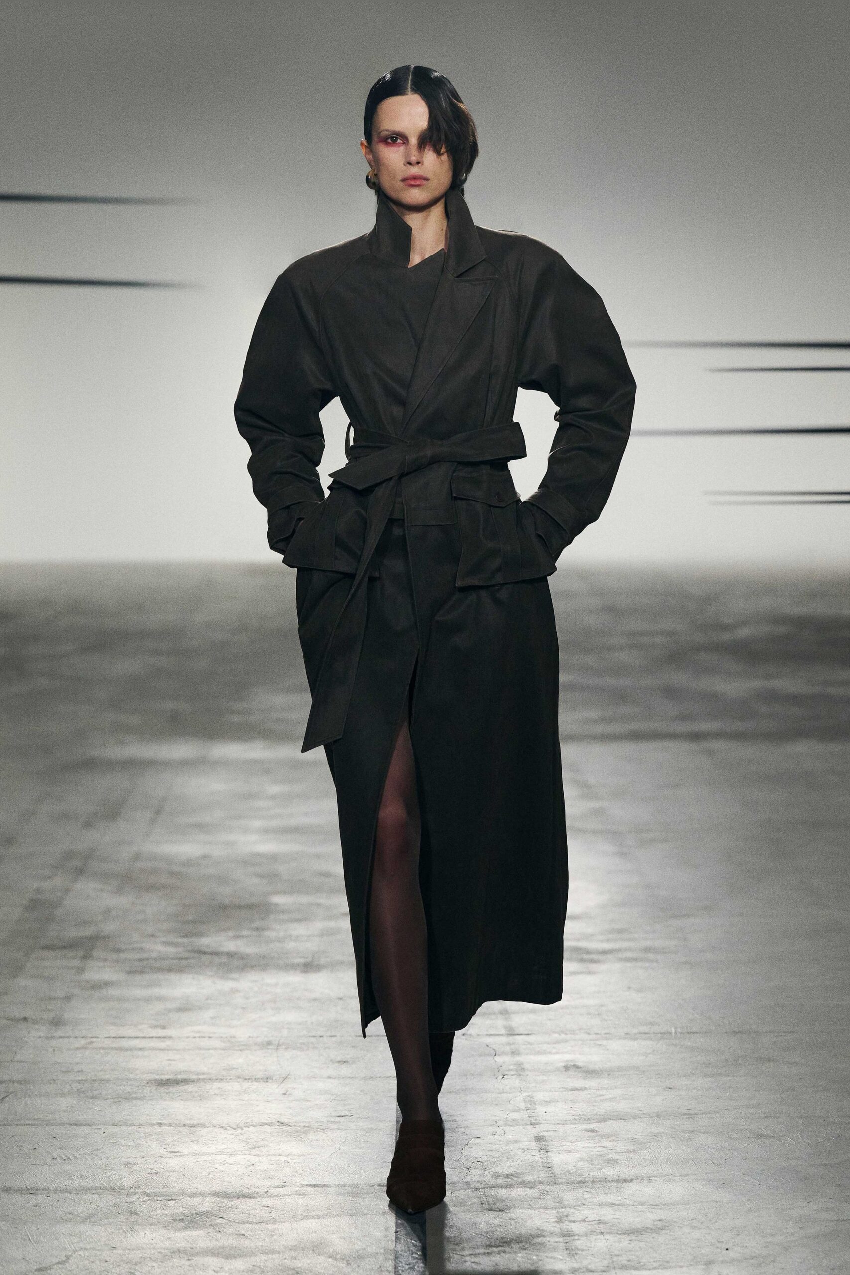 black cotton long-sleeve collared relaxed belted zippered coat