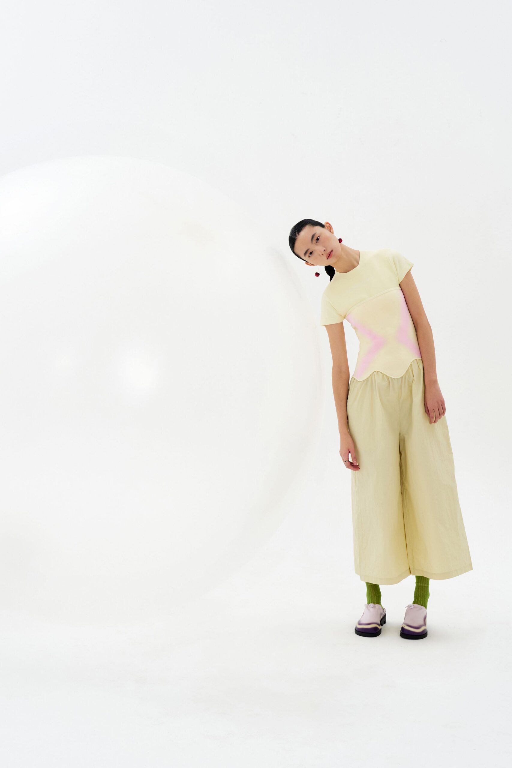 yellow color-blocked top with beige wide-leg pants