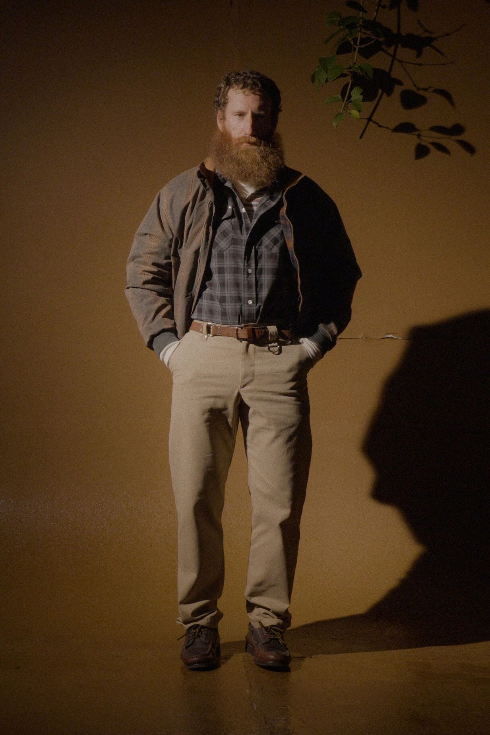 brown jacket gray checked shirt beige pants
