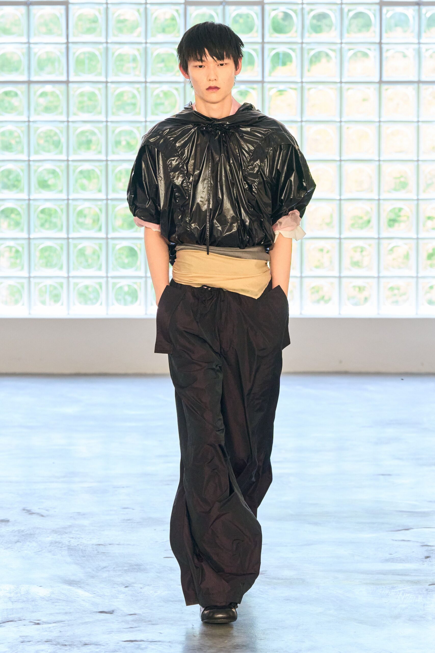 black vinyl short-sleeve hooded relaxed pleated top