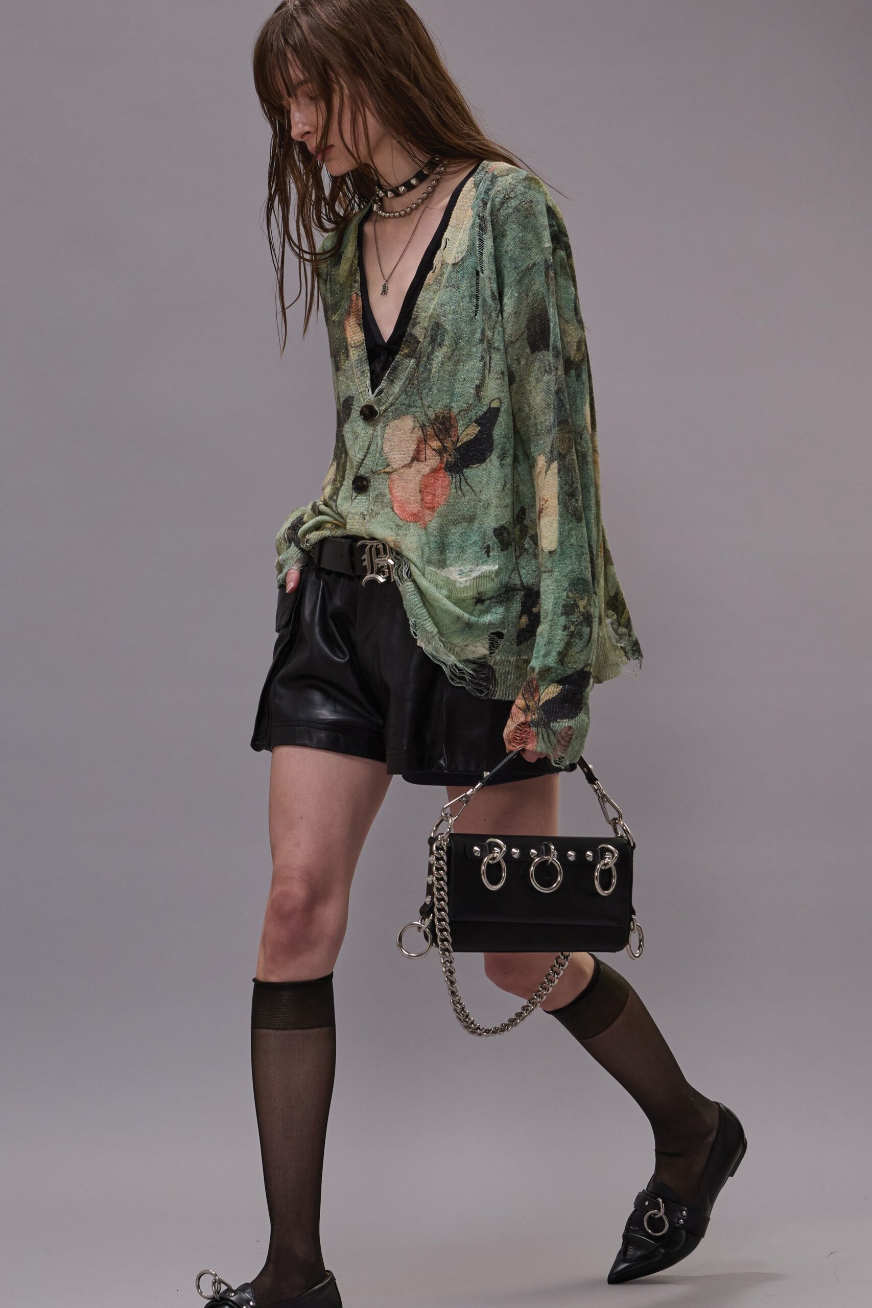 green floral relaxed top with black shorts