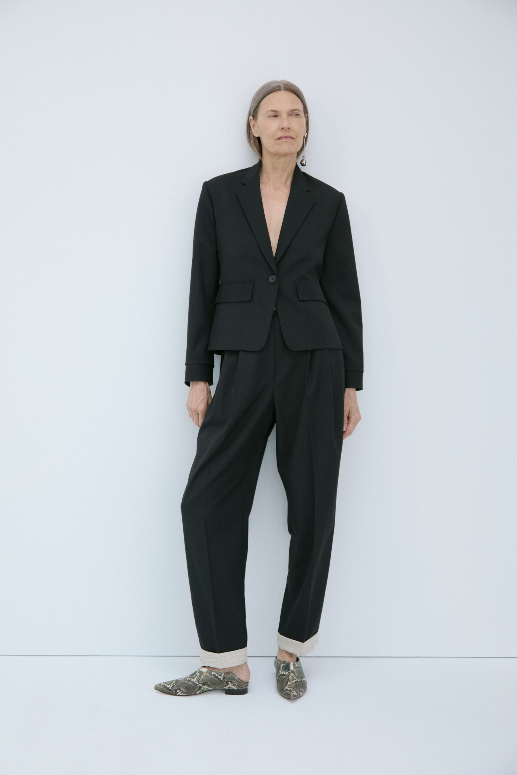 black tailored blazer with relaxed pants