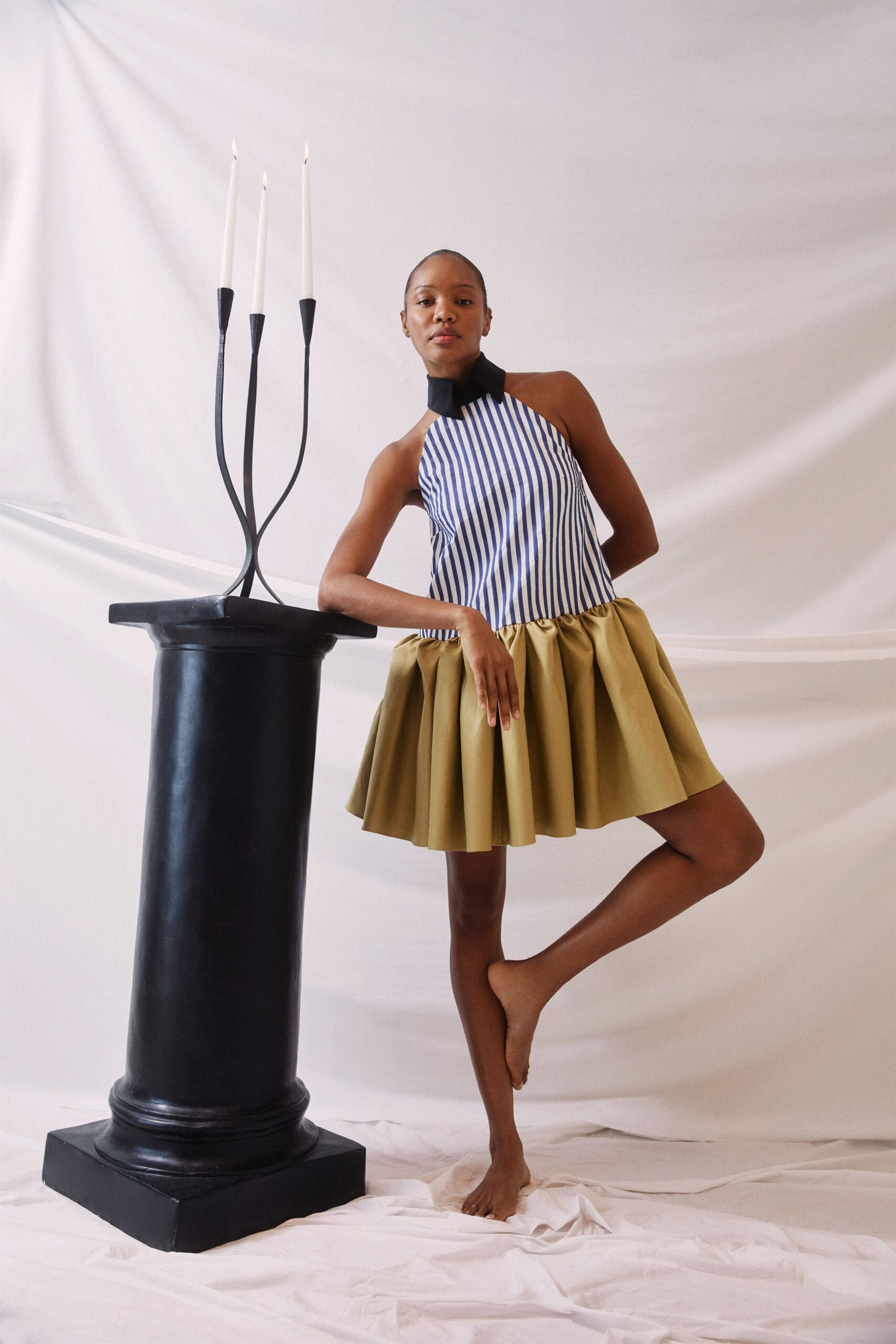 striped top and pleated skirt