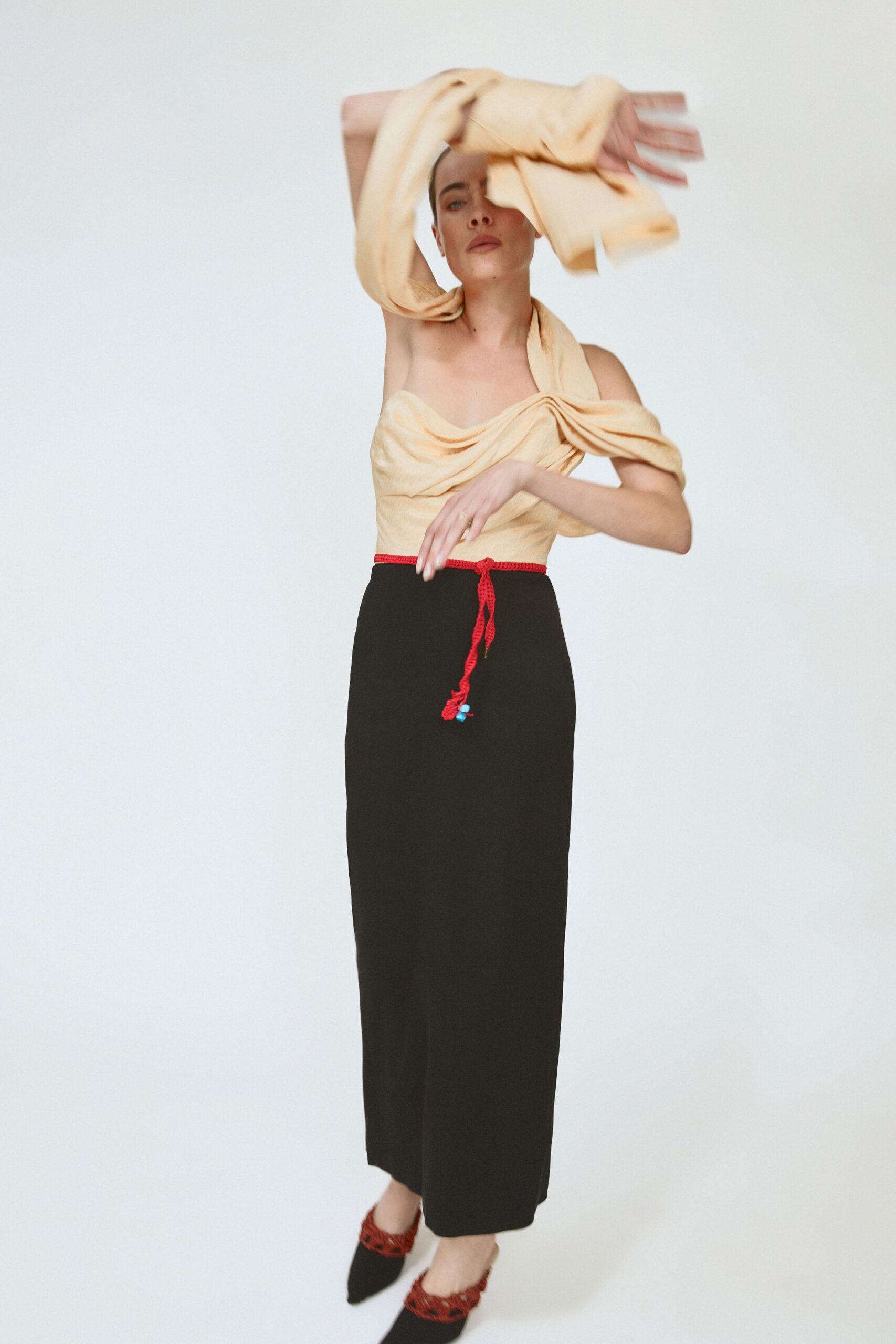 beige silk top black midi skirt
