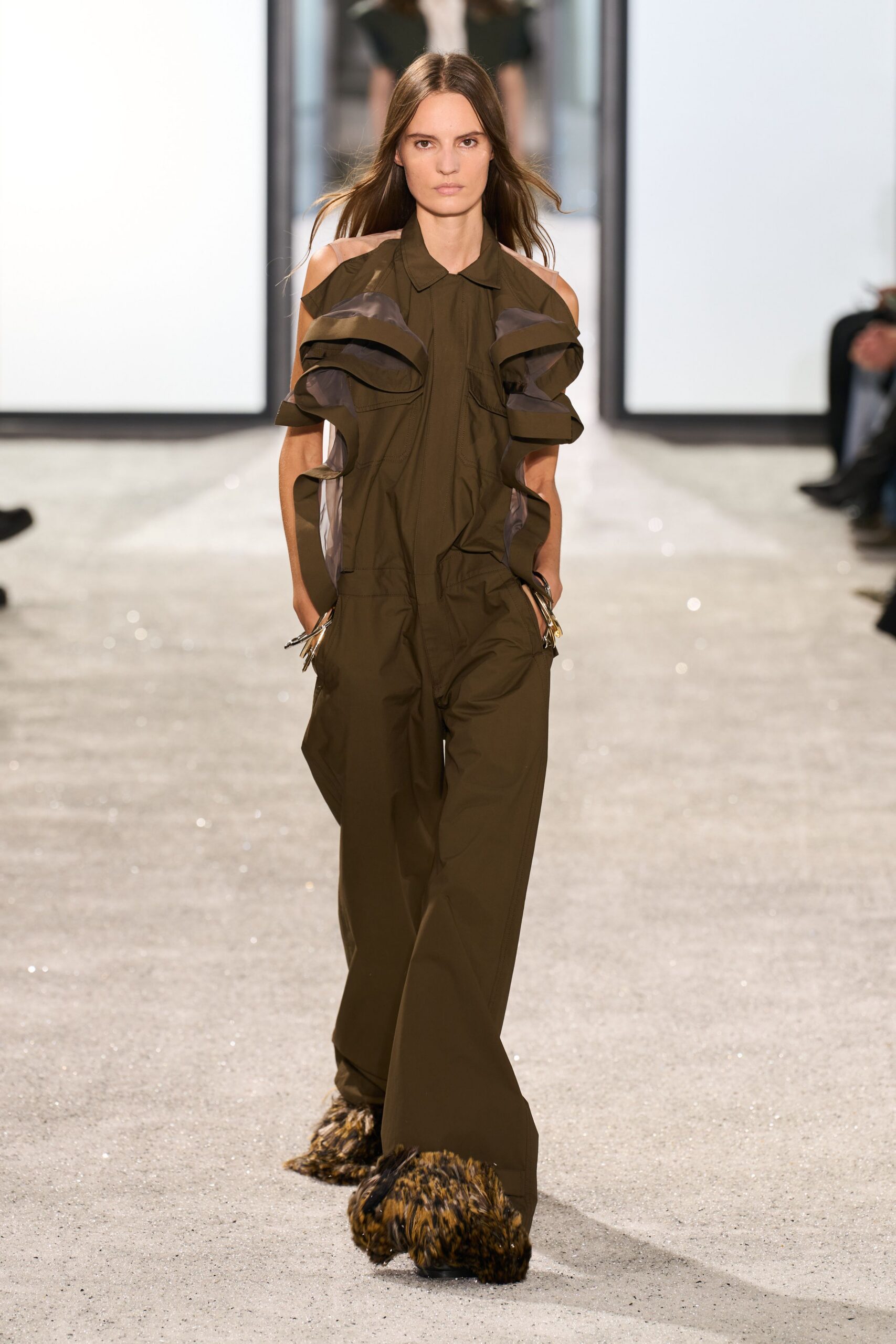brown ruffled jumpsuit with fur shoes