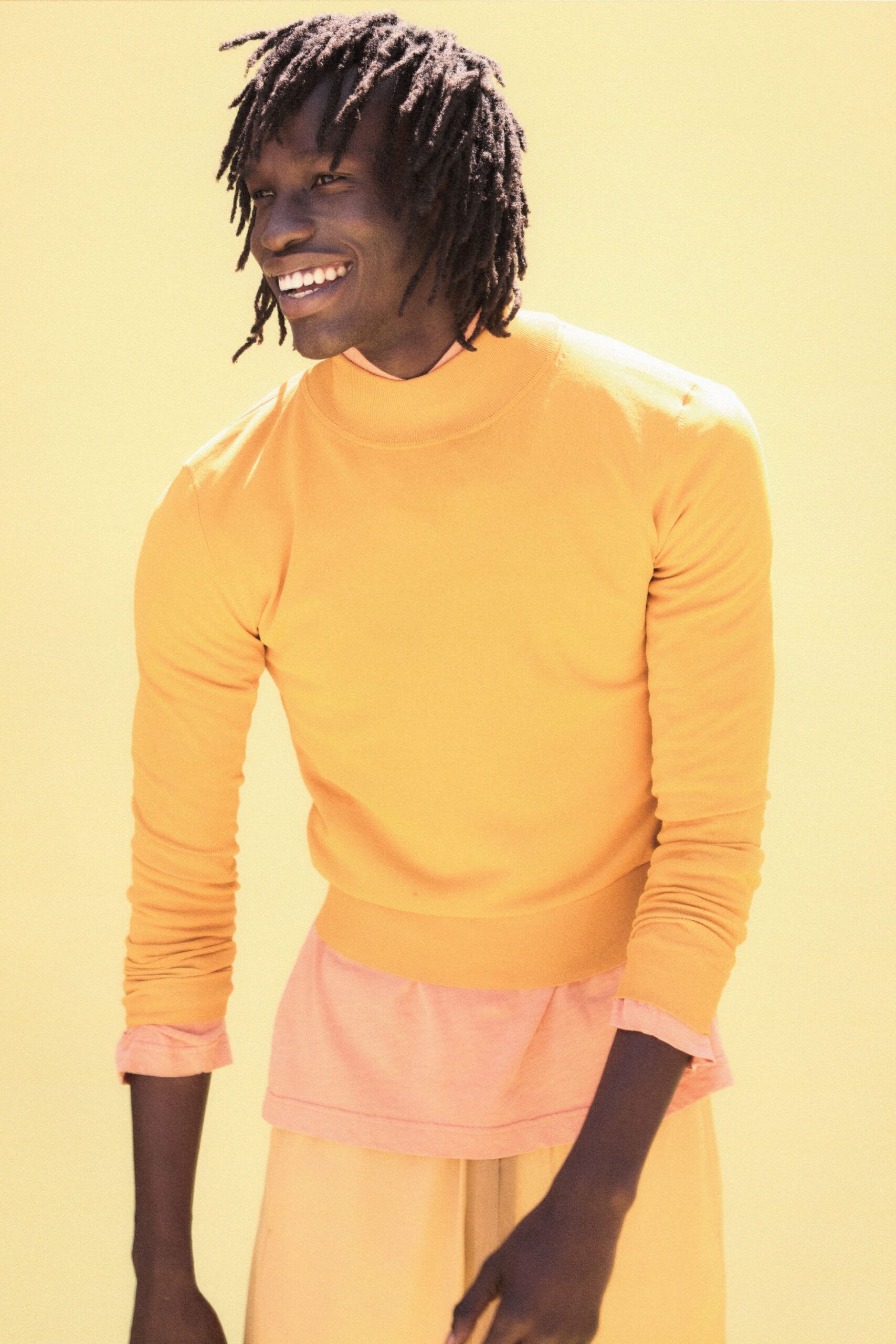 yellow and pink layered tops with beige pants