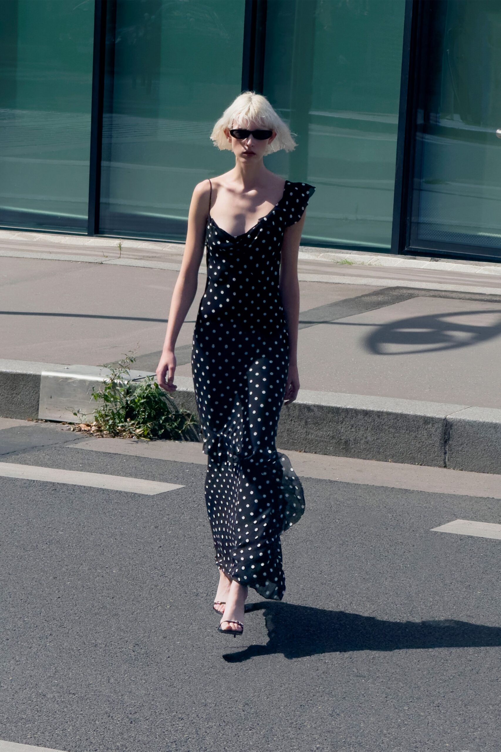 black polka-dot gown with sunglasses