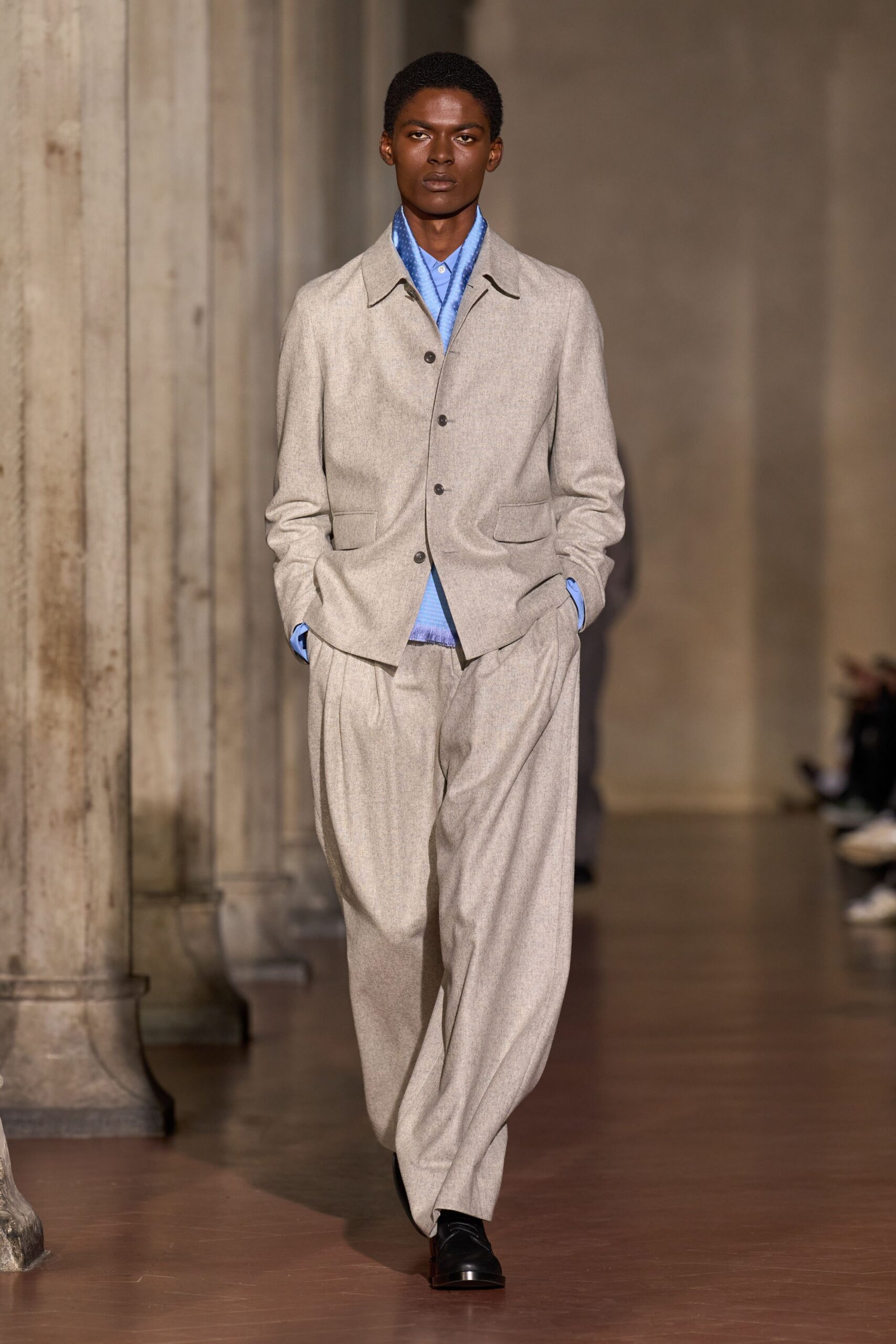 gray tailored suit with blue shirt