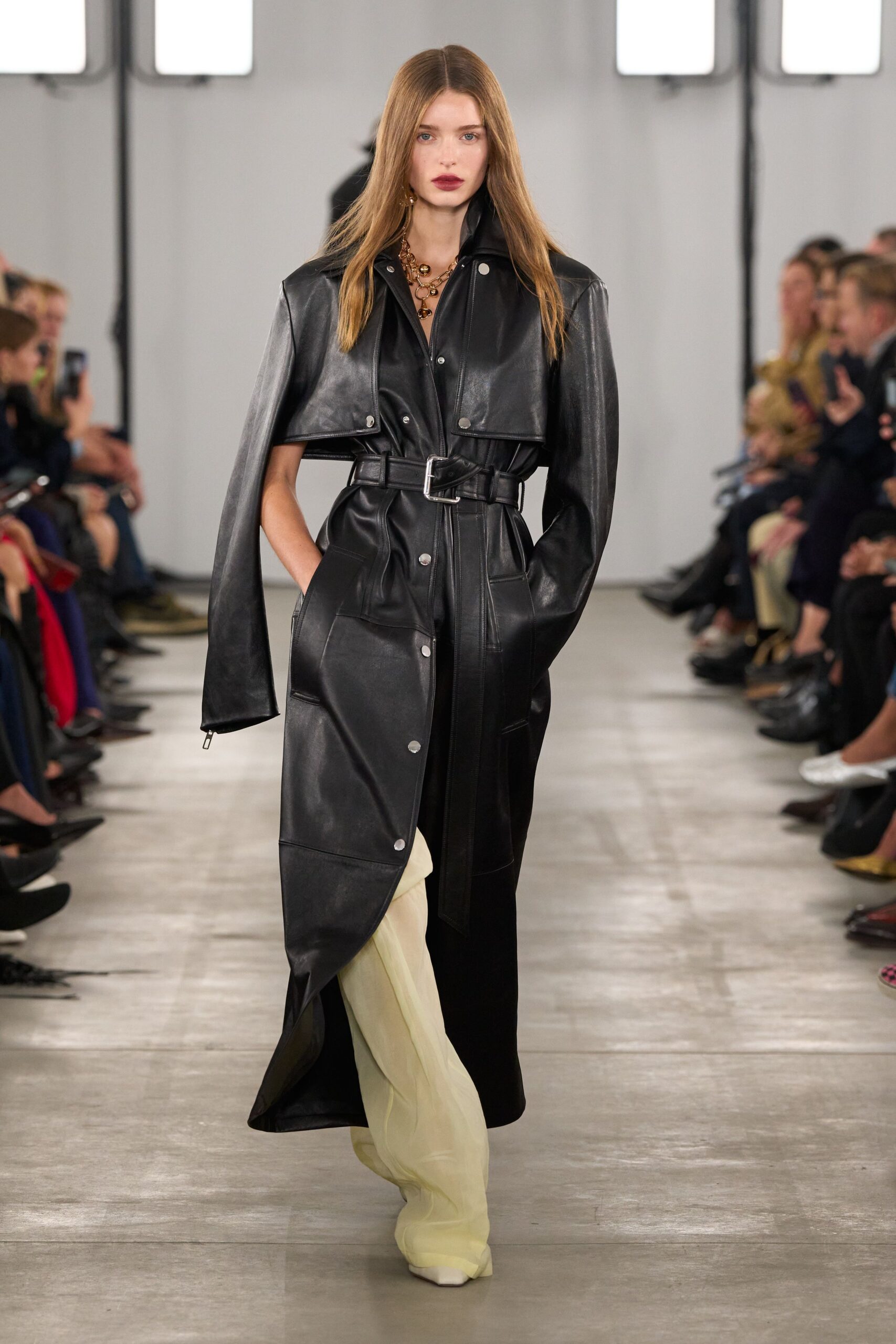 black leather long-sleeve collared fitted buttoned belted coat