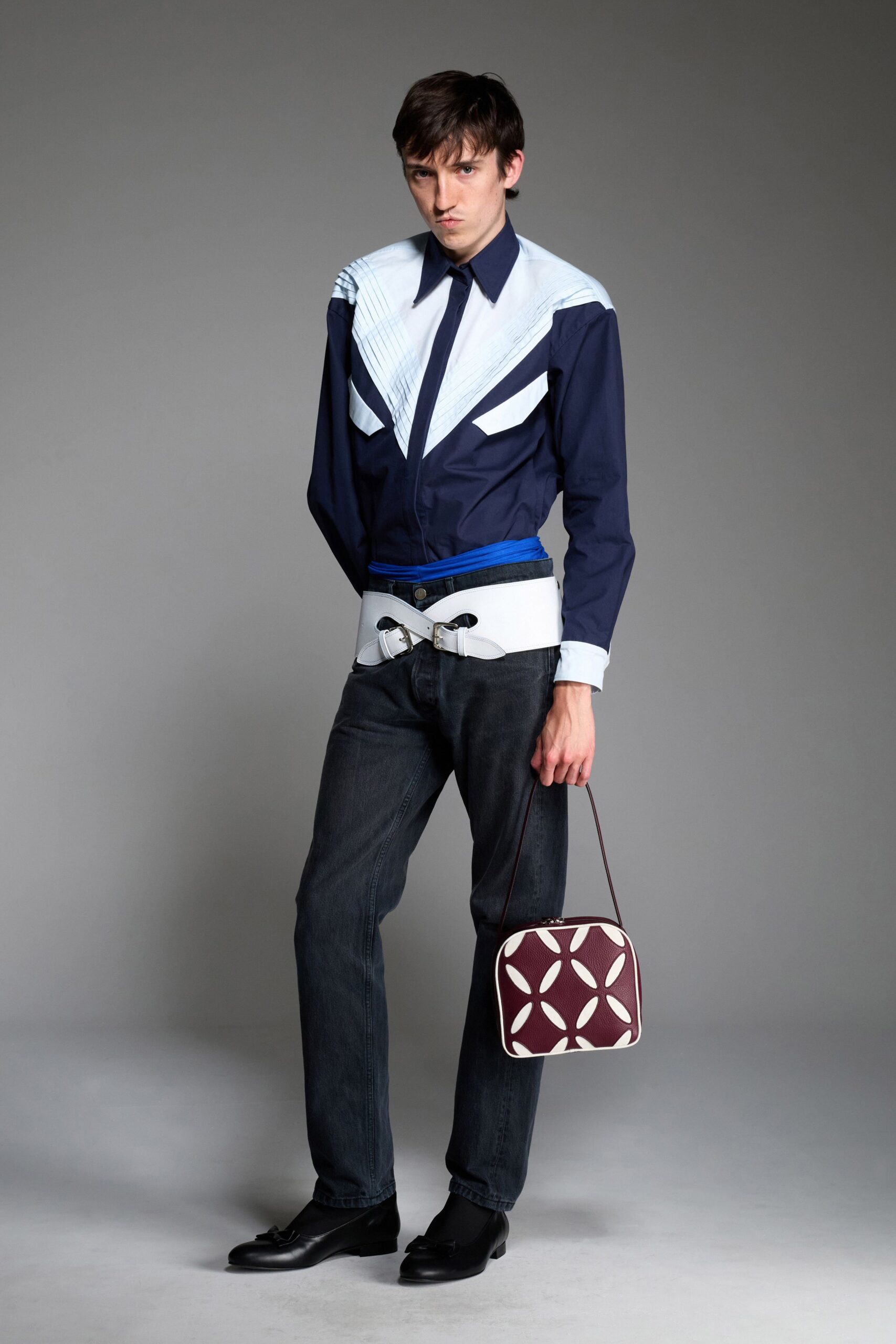 blue and white fitted shirt with black pants