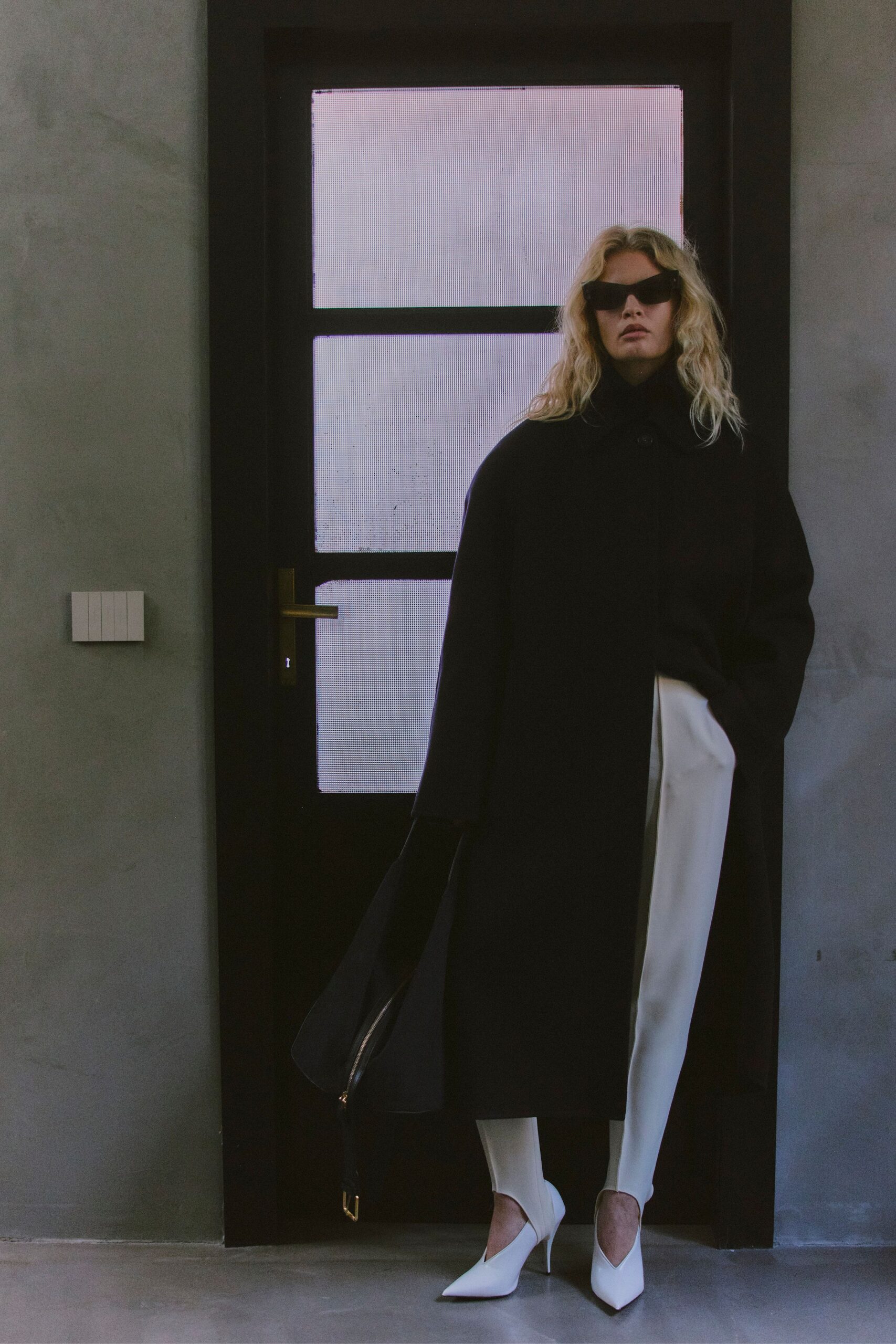 black wool long-sleeve collared relaxed coat