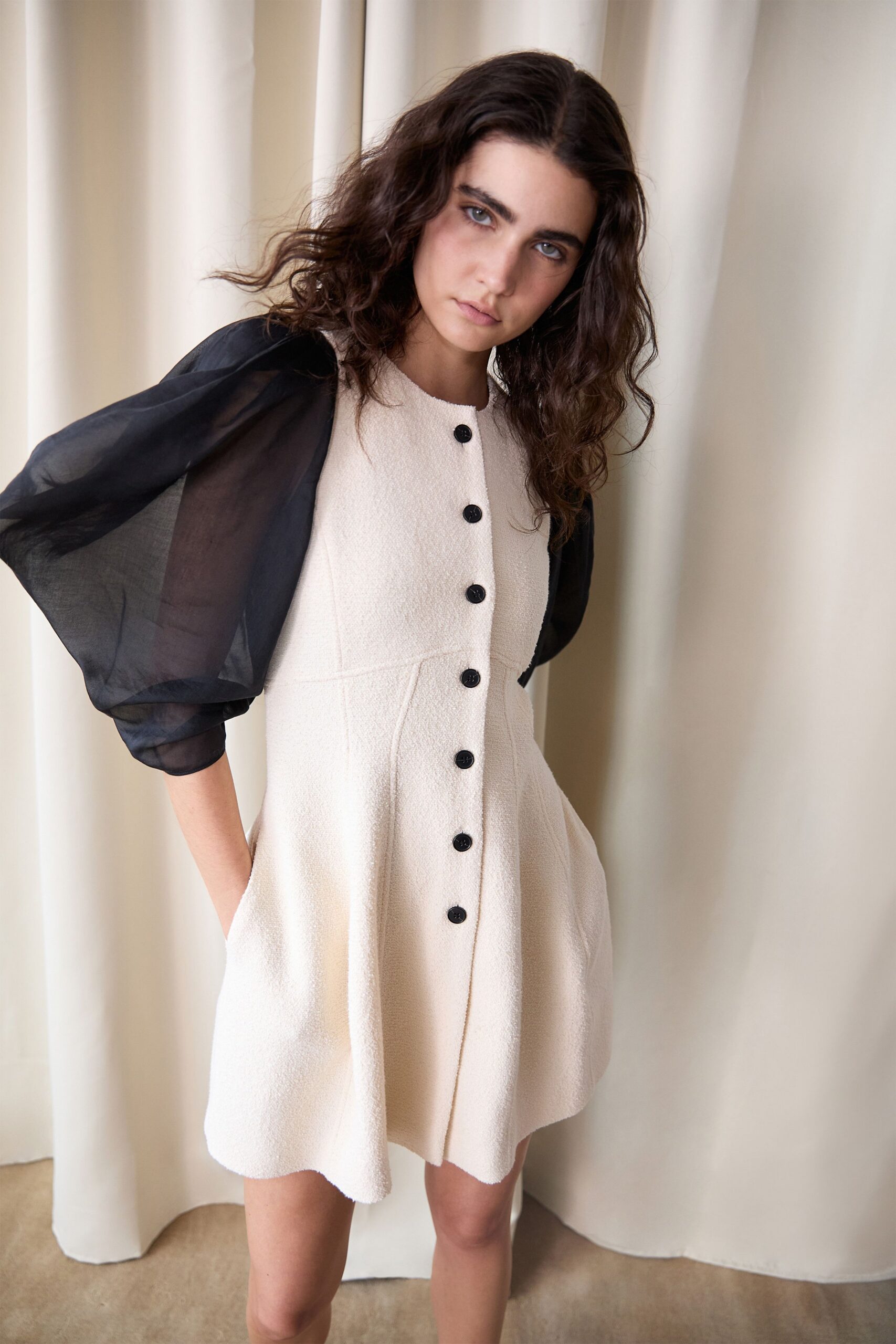 white cotton sleeveless collared fitted buttoned a-line dress