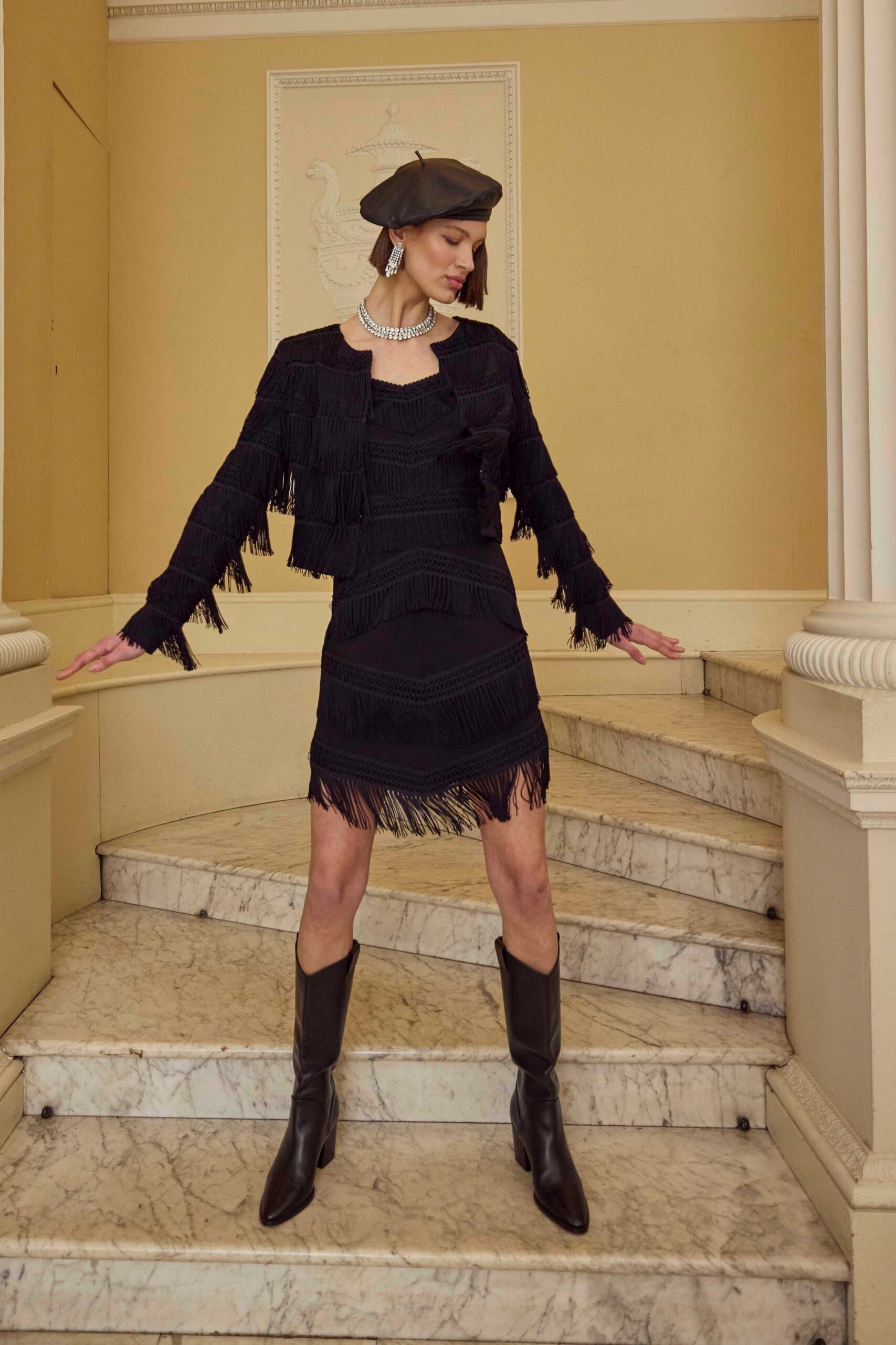 black fringed jacket and dress