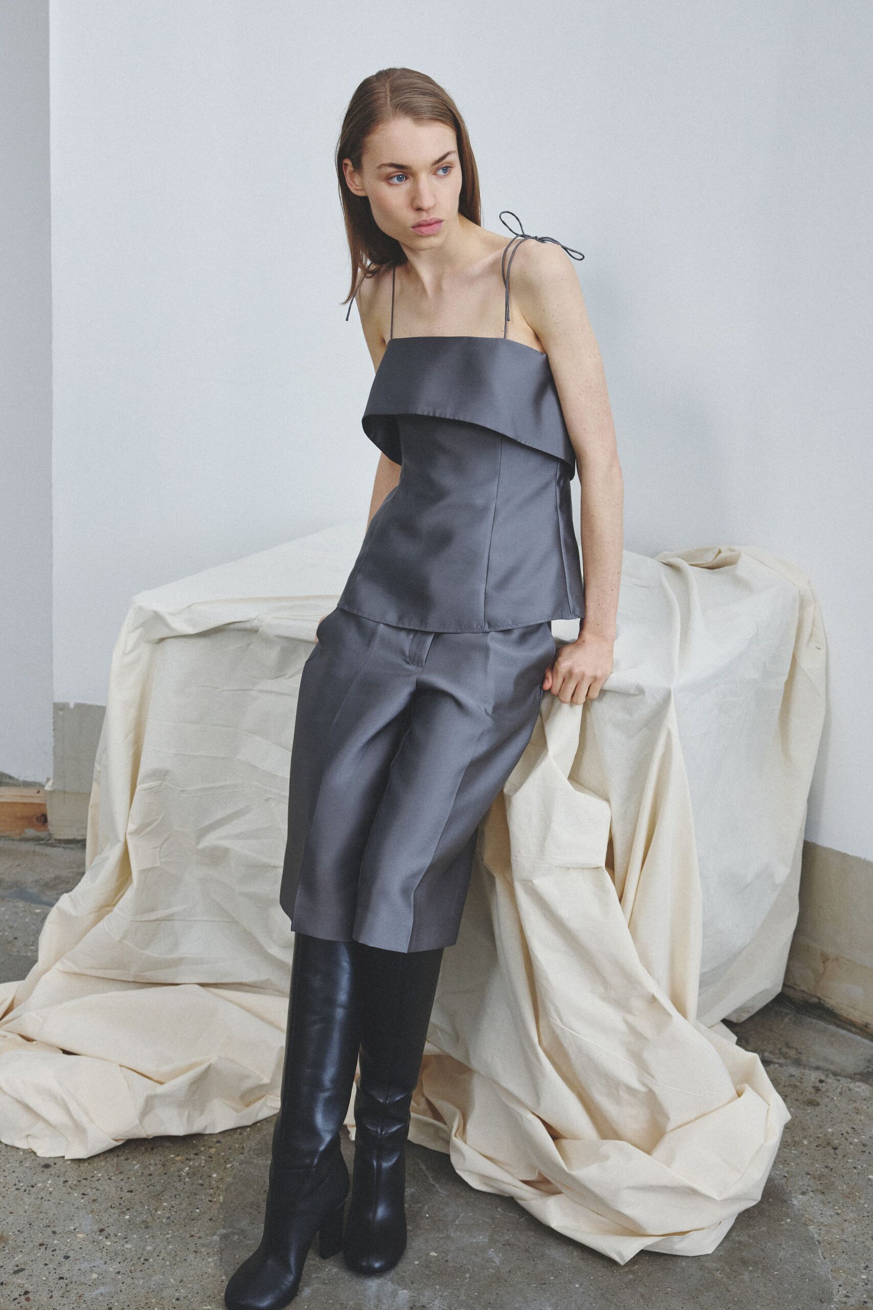 gray satin sleeveless off-shoulder fitted draped cropped jumpsuit