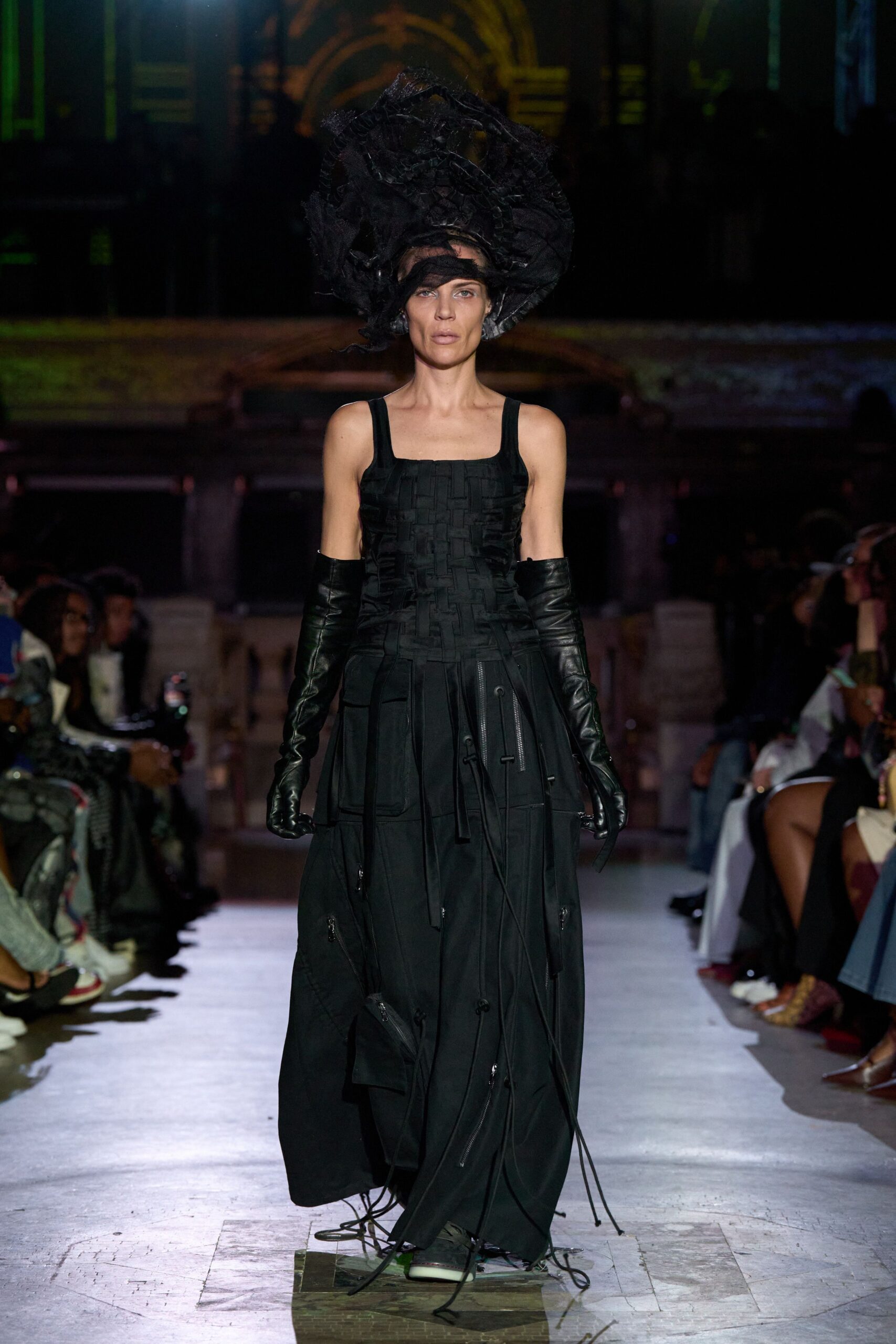 black fitted gown with gloves and hat