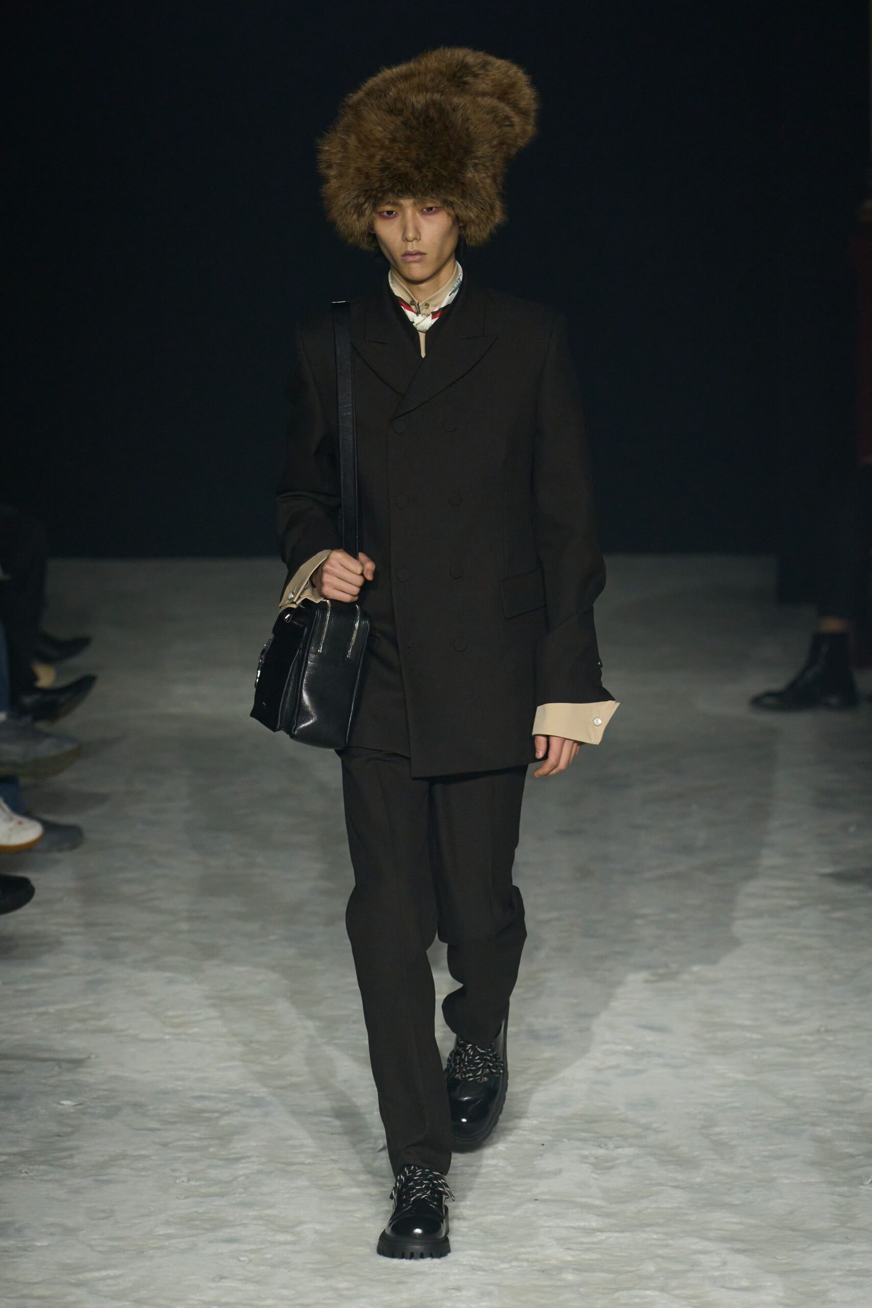 black tailored suit with fur hat