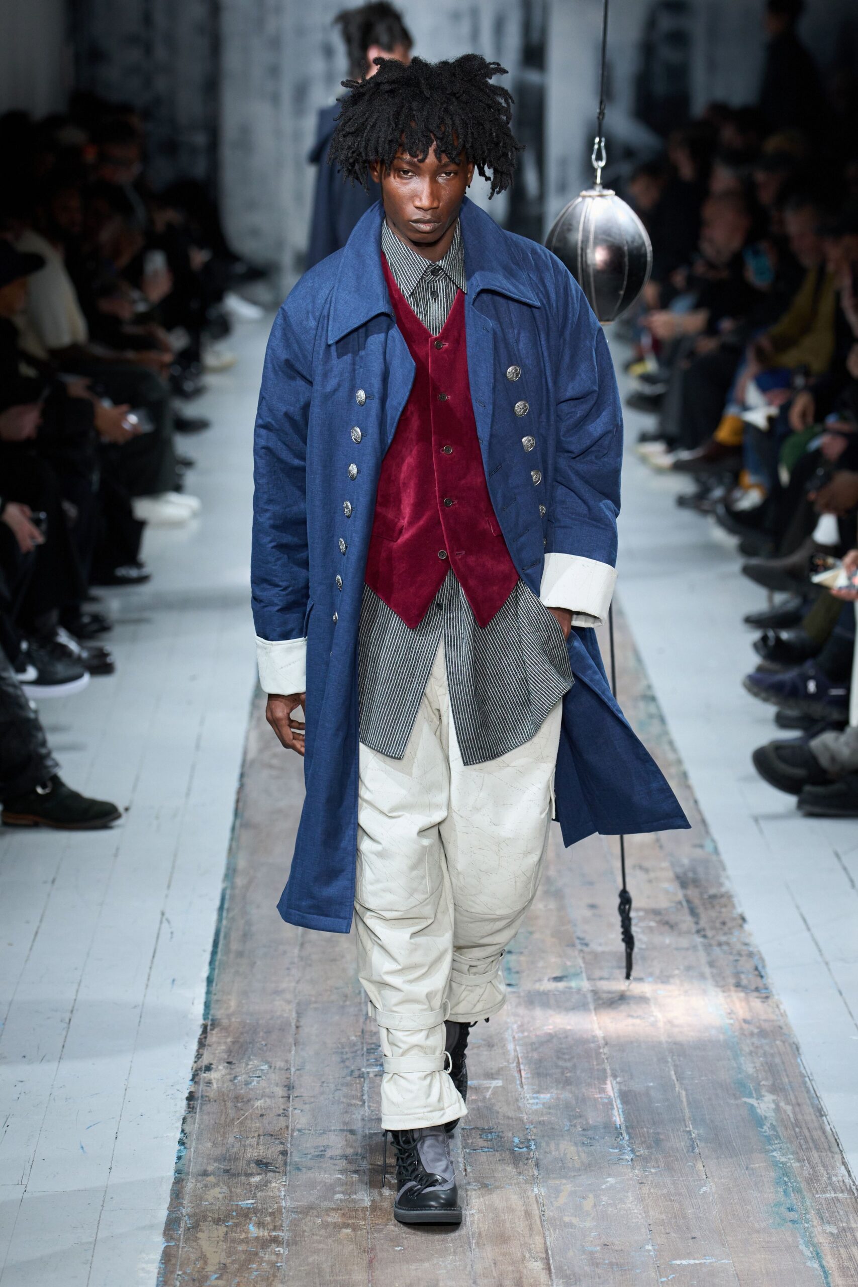 blue coat red vest white shirt