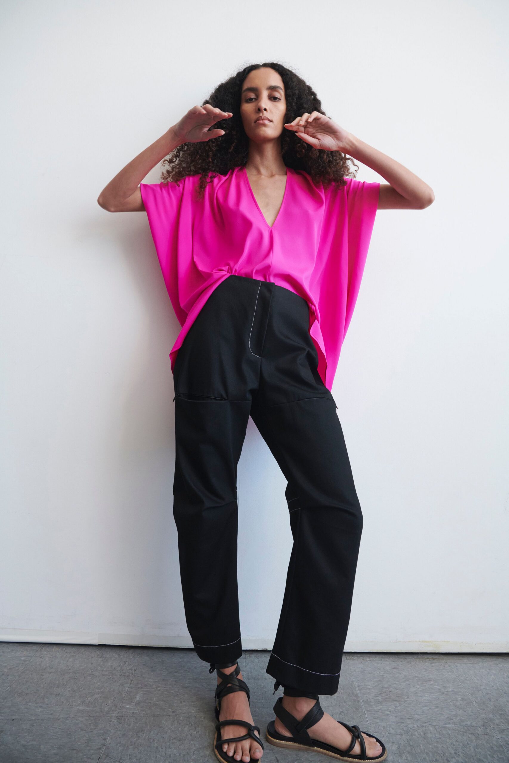 pink relaxed top with black pants