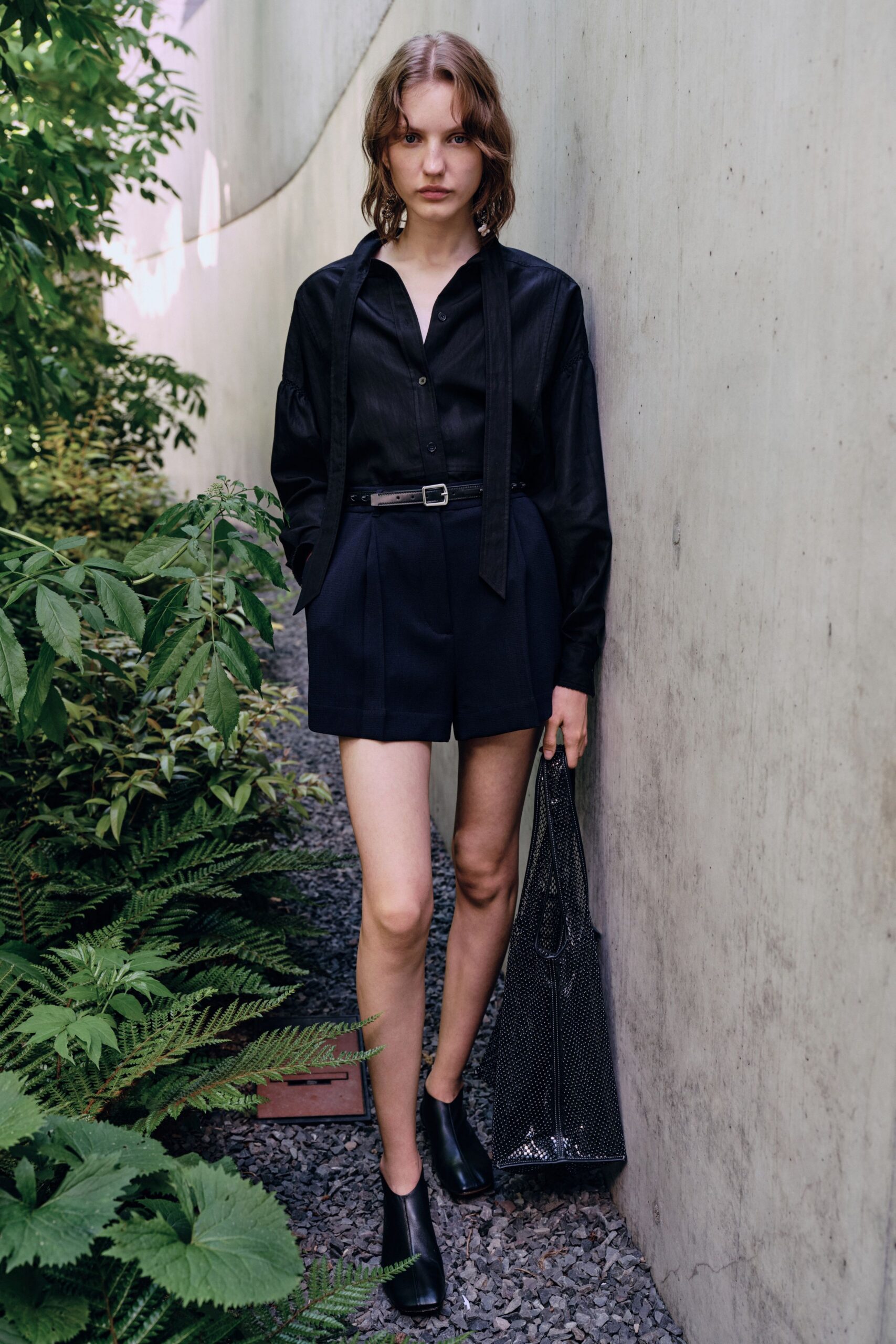black fitted shirt with navy shorts