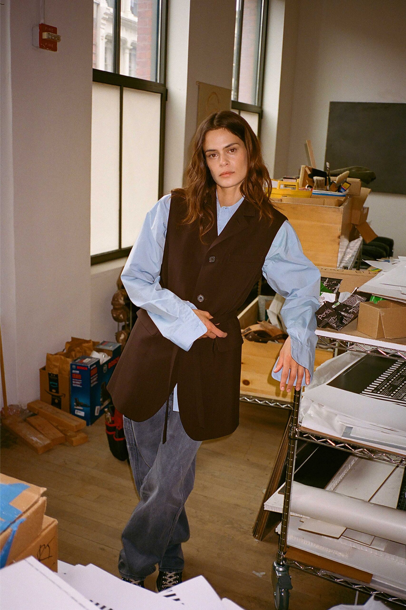 brown vest blue shirt denim pants