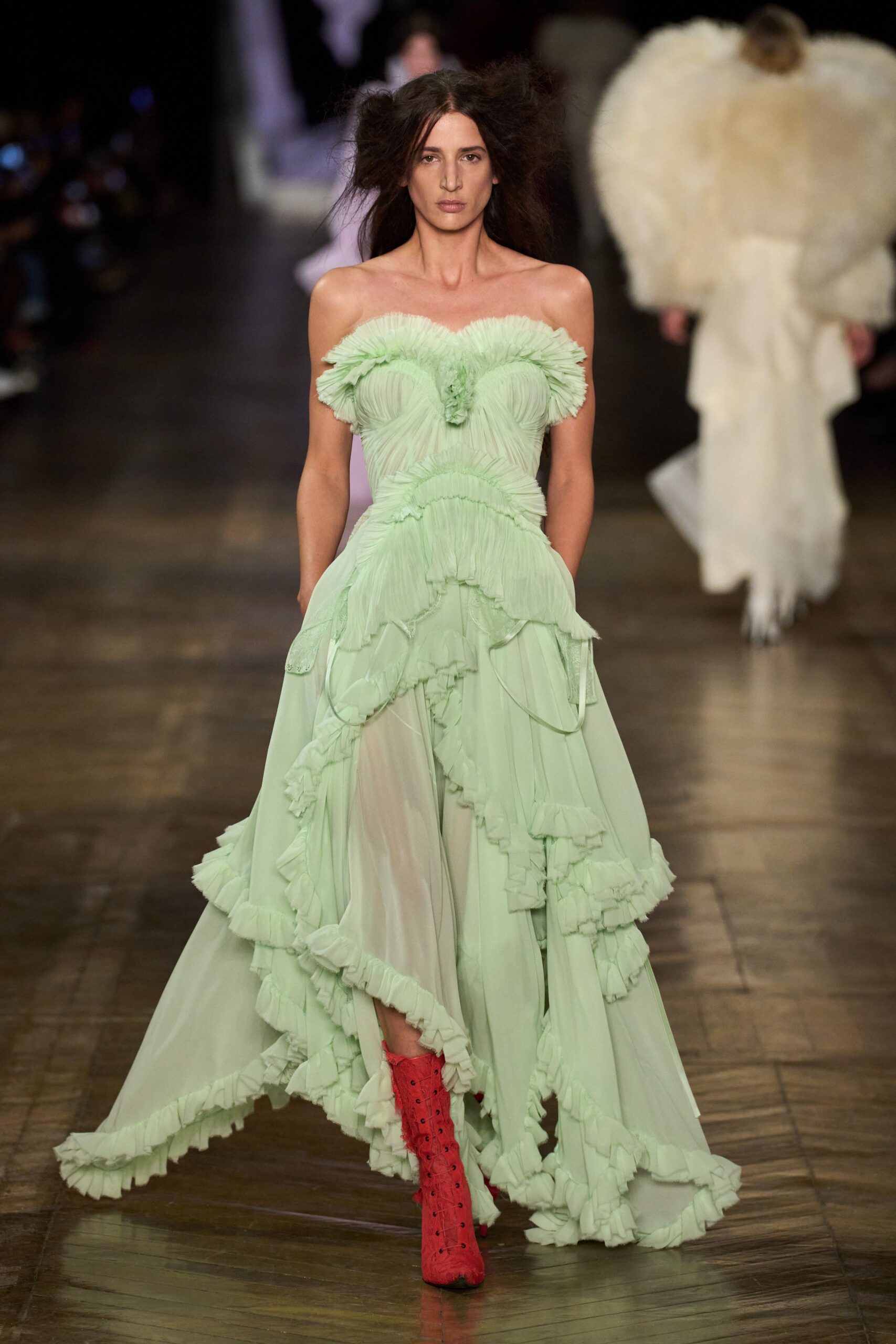 green chiffon strapless fitted ruffled layered flowing gown