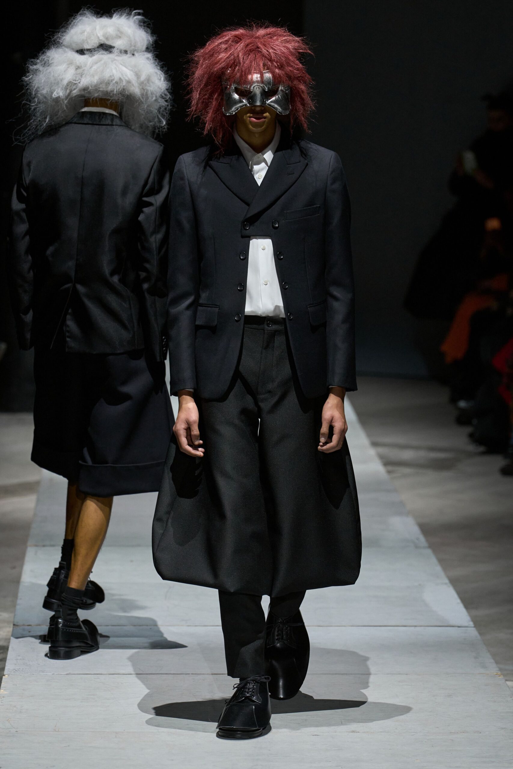 black tailored suit with mask