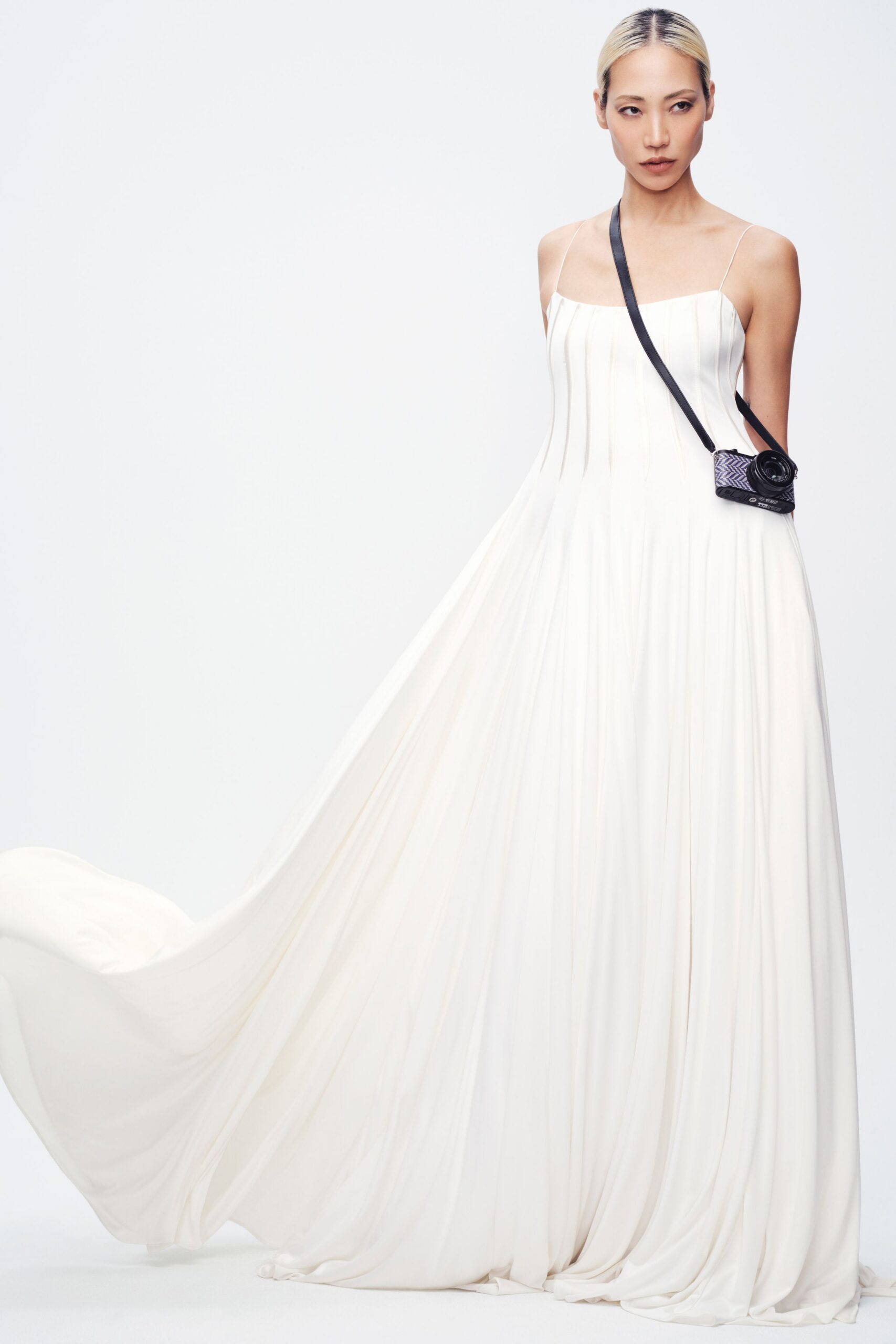 white pleated sleeveless gown