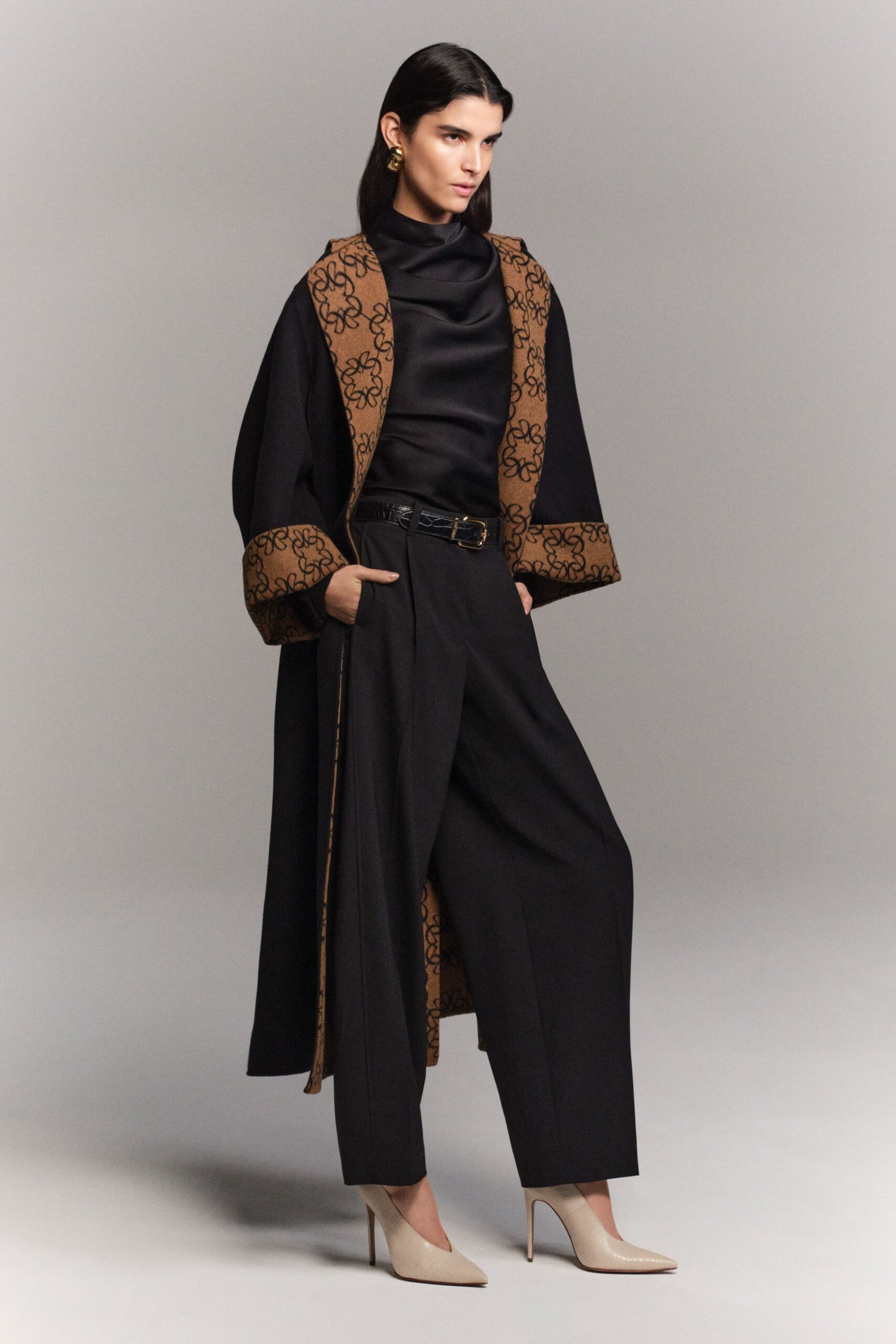 black wool coat with embroidered details