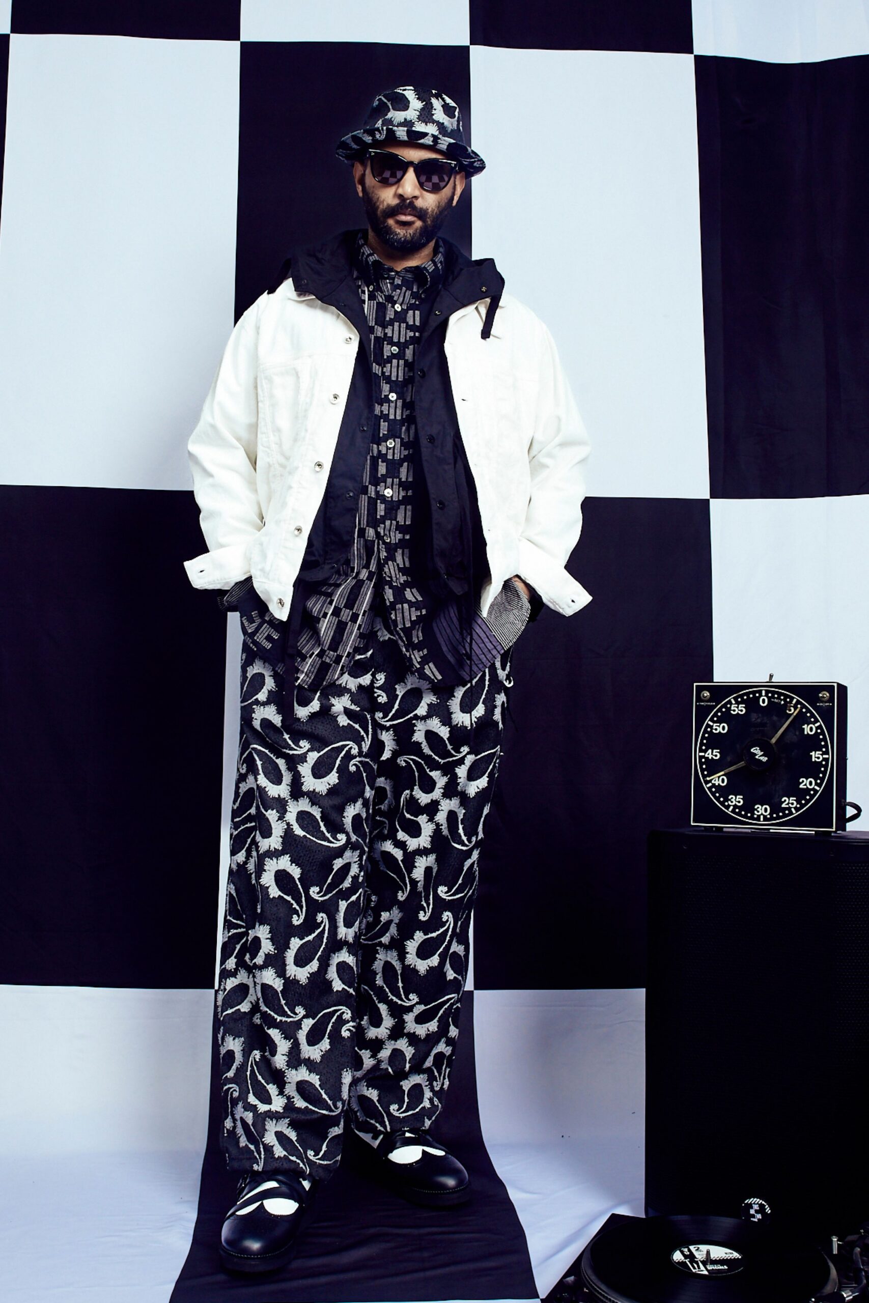 white jacket black printed shirt