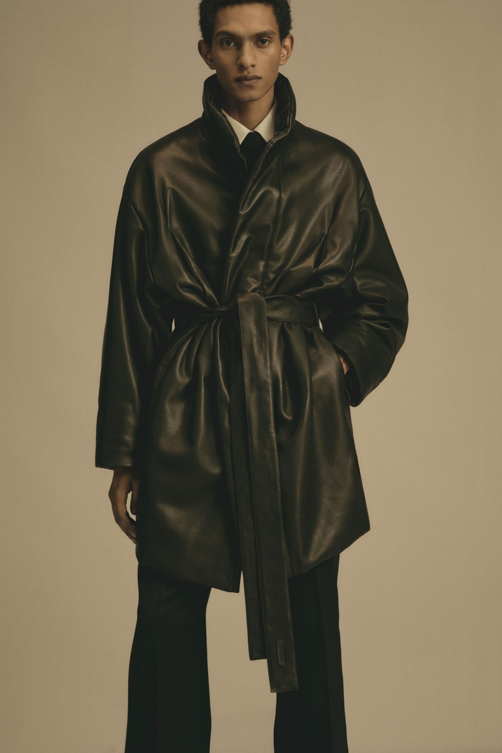 black leather long-sleeve collared relaxed belted coat