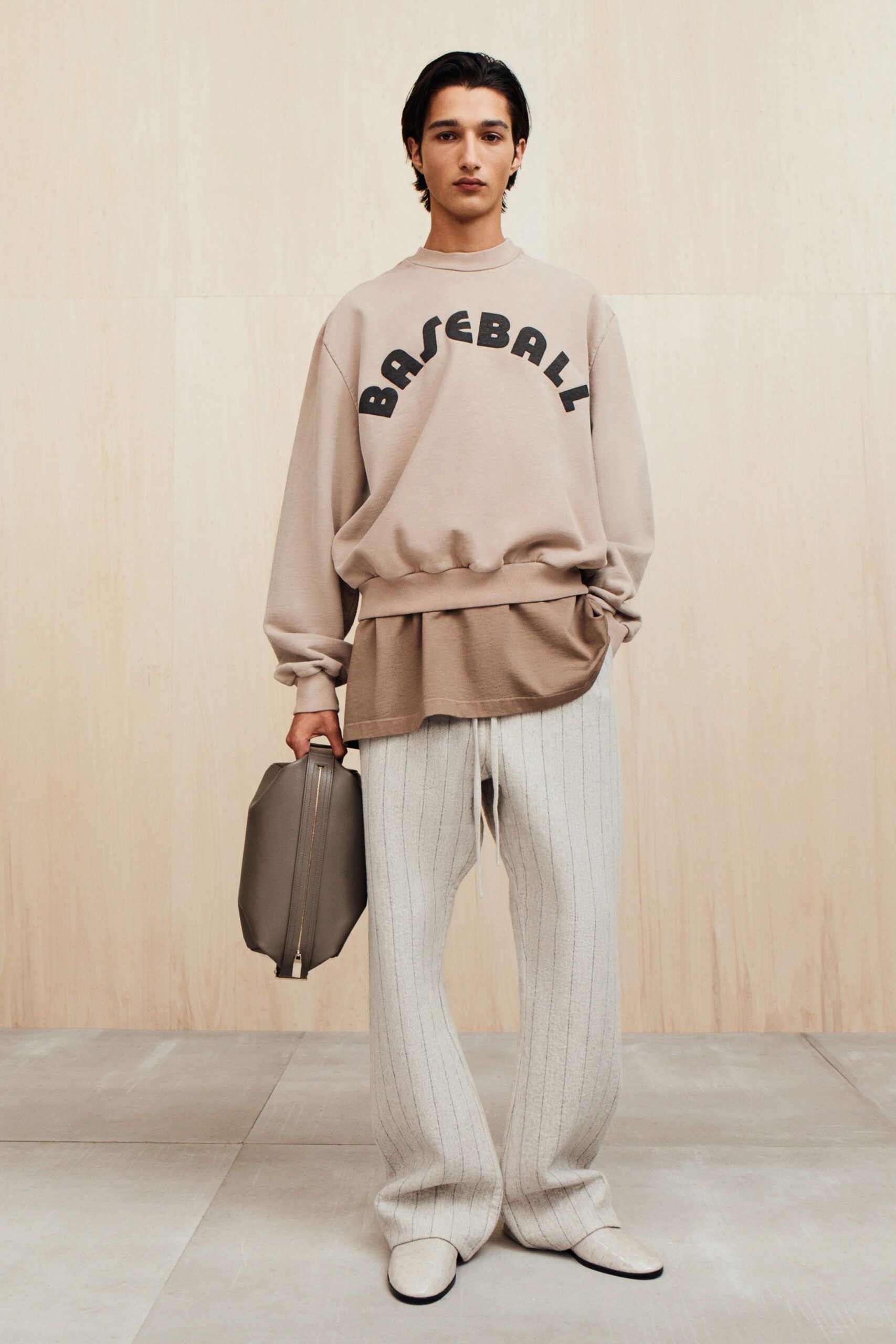 beige sweater and white pants