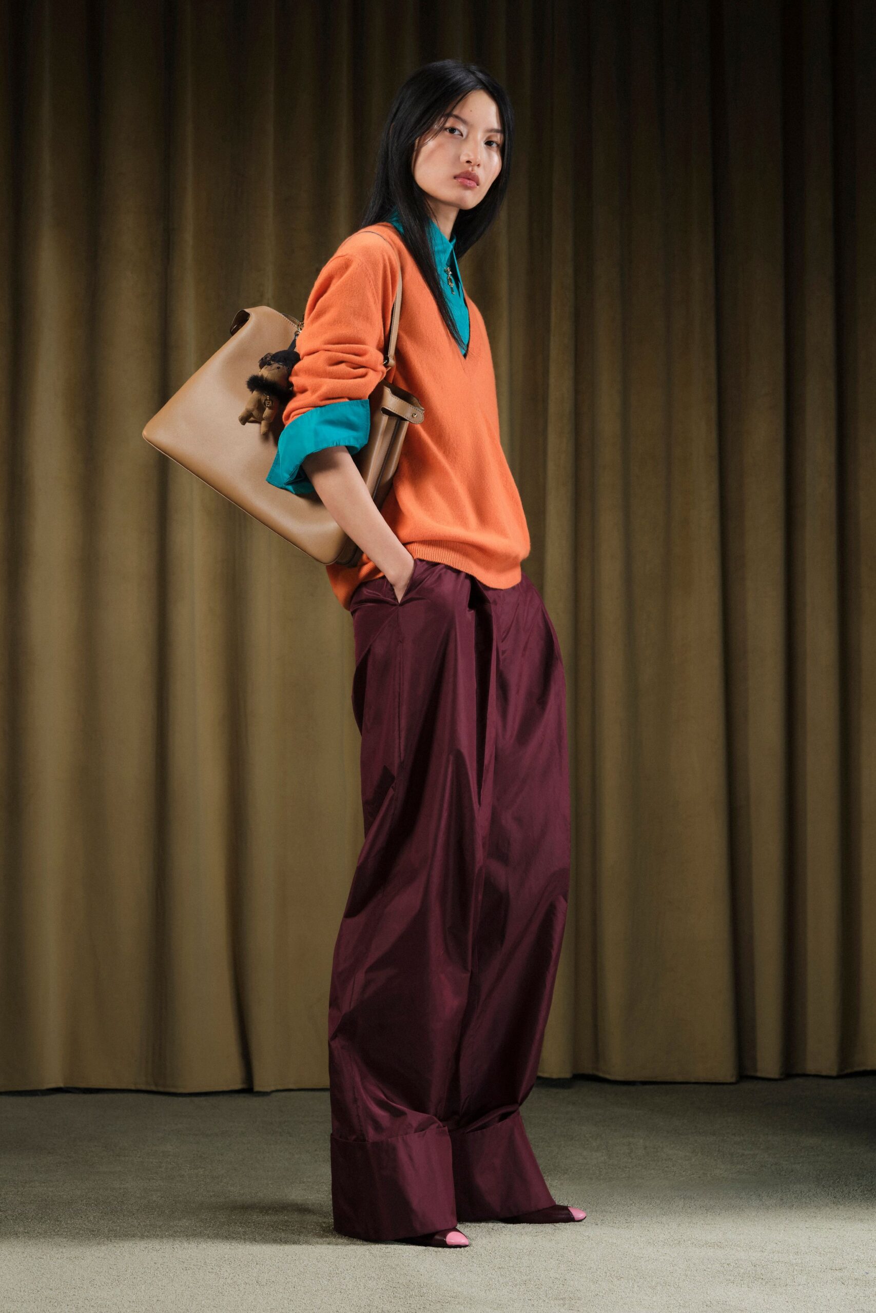 orange sweater blue shirt maroon pants