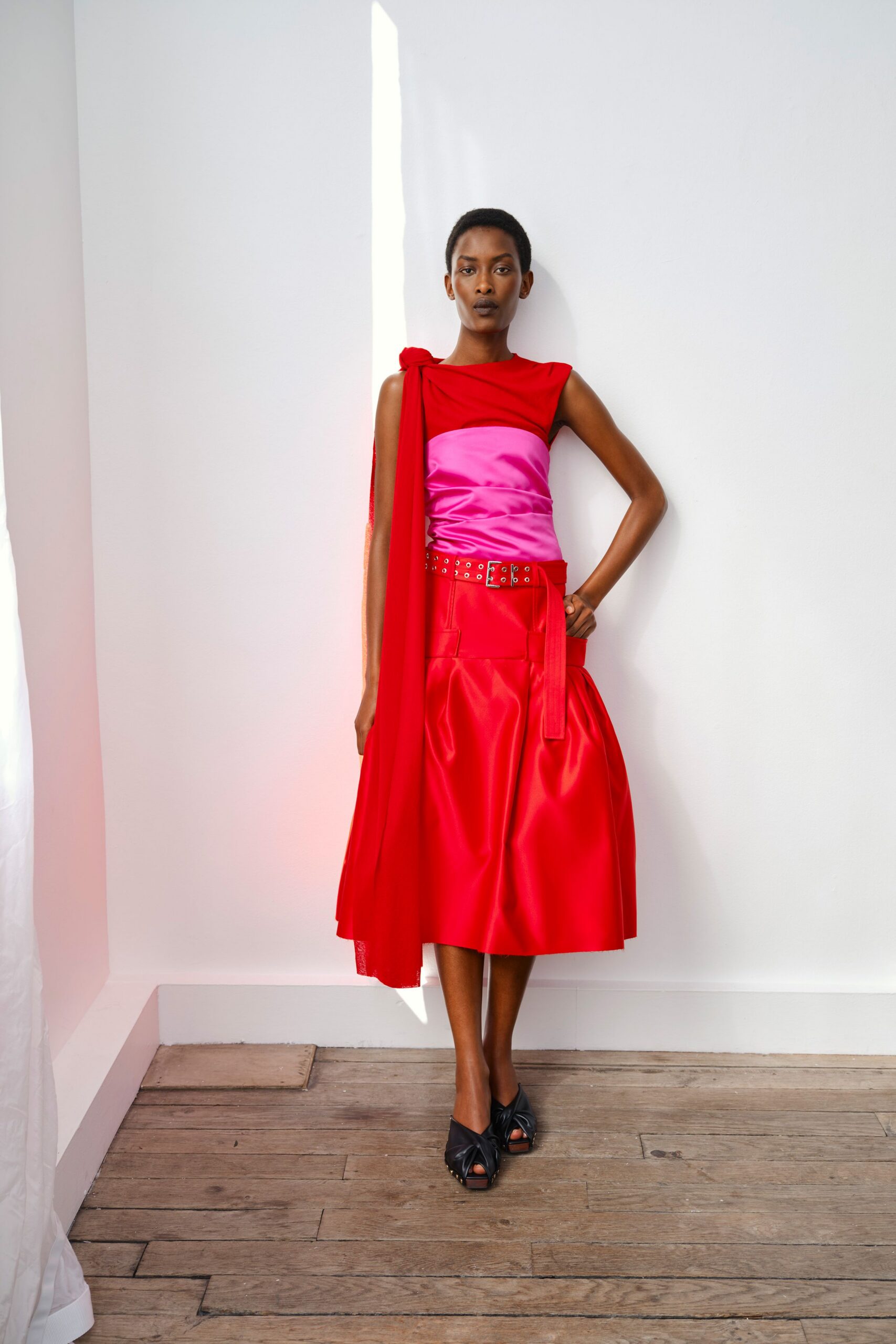 red and pink midi dress with black shoes